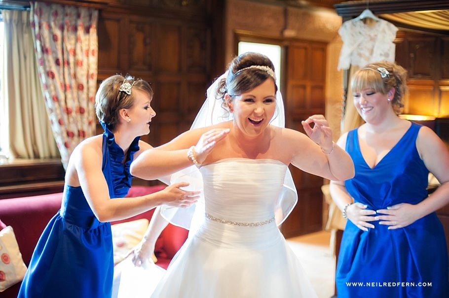 Bride putting on wedding dress 02 Bride putting on wedding dress 02