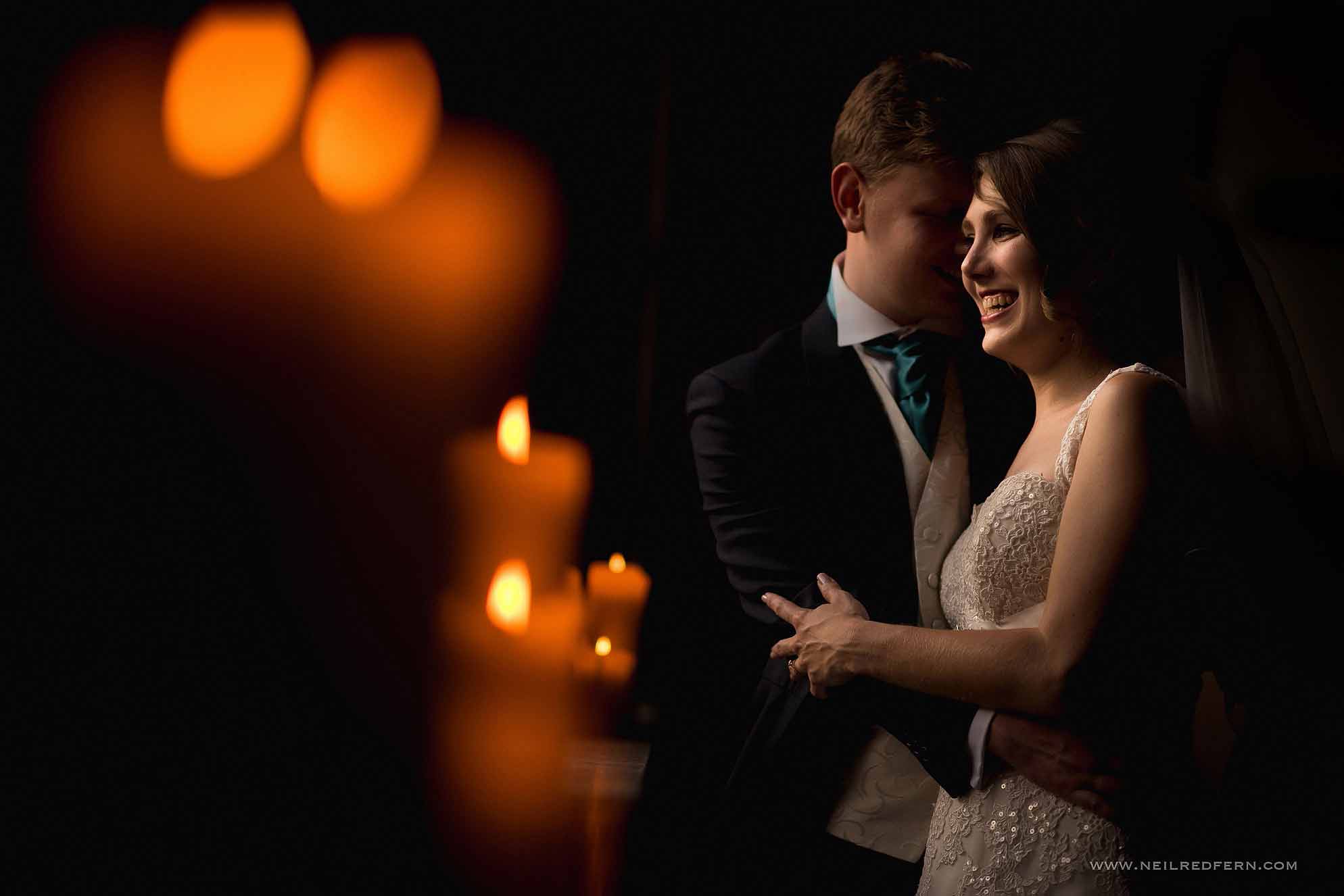bride and groom photograph with candles