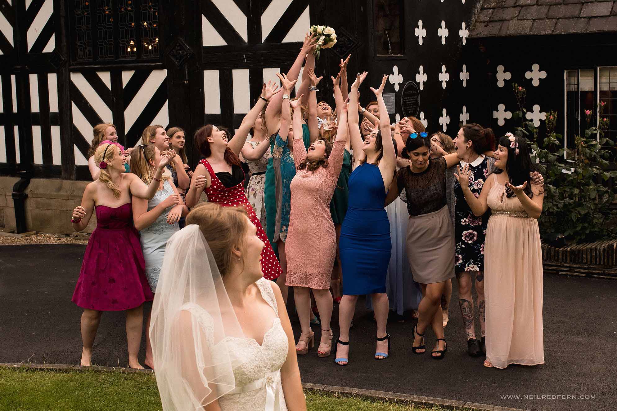 bride throwing bouquet
