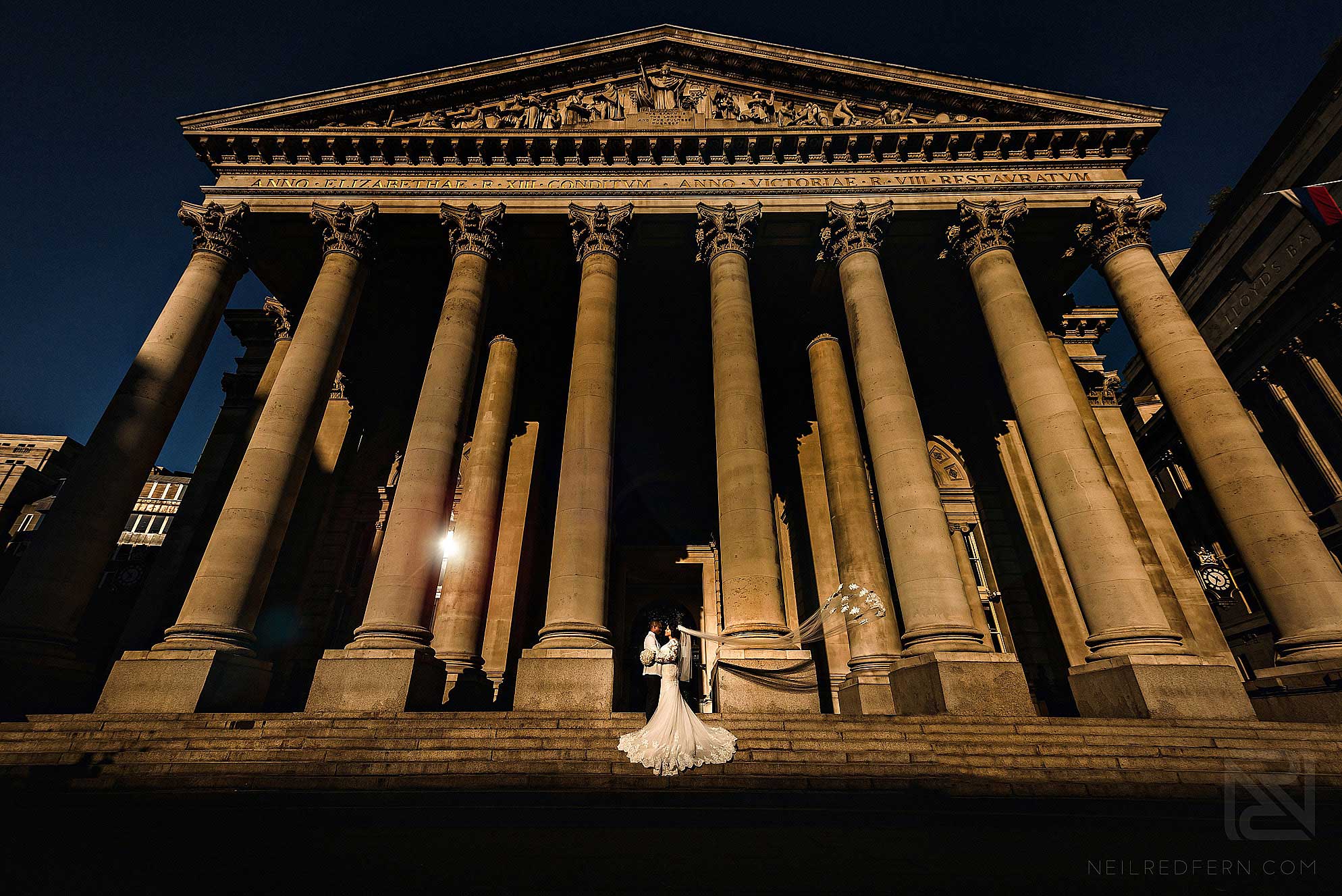 bride and groom on steps of Royal Exchange London