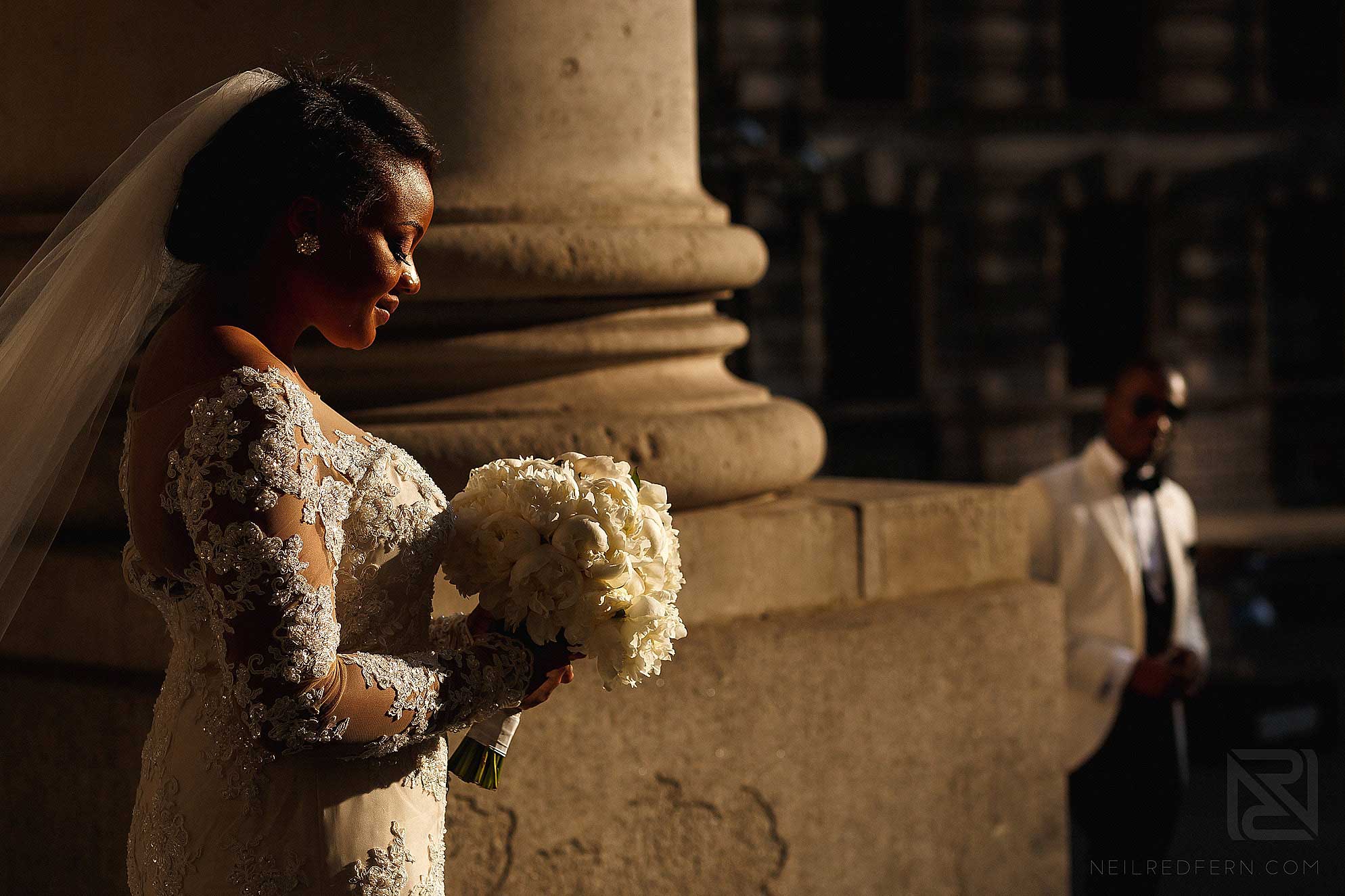 bride and bouquet on steps of Royal Exchange London