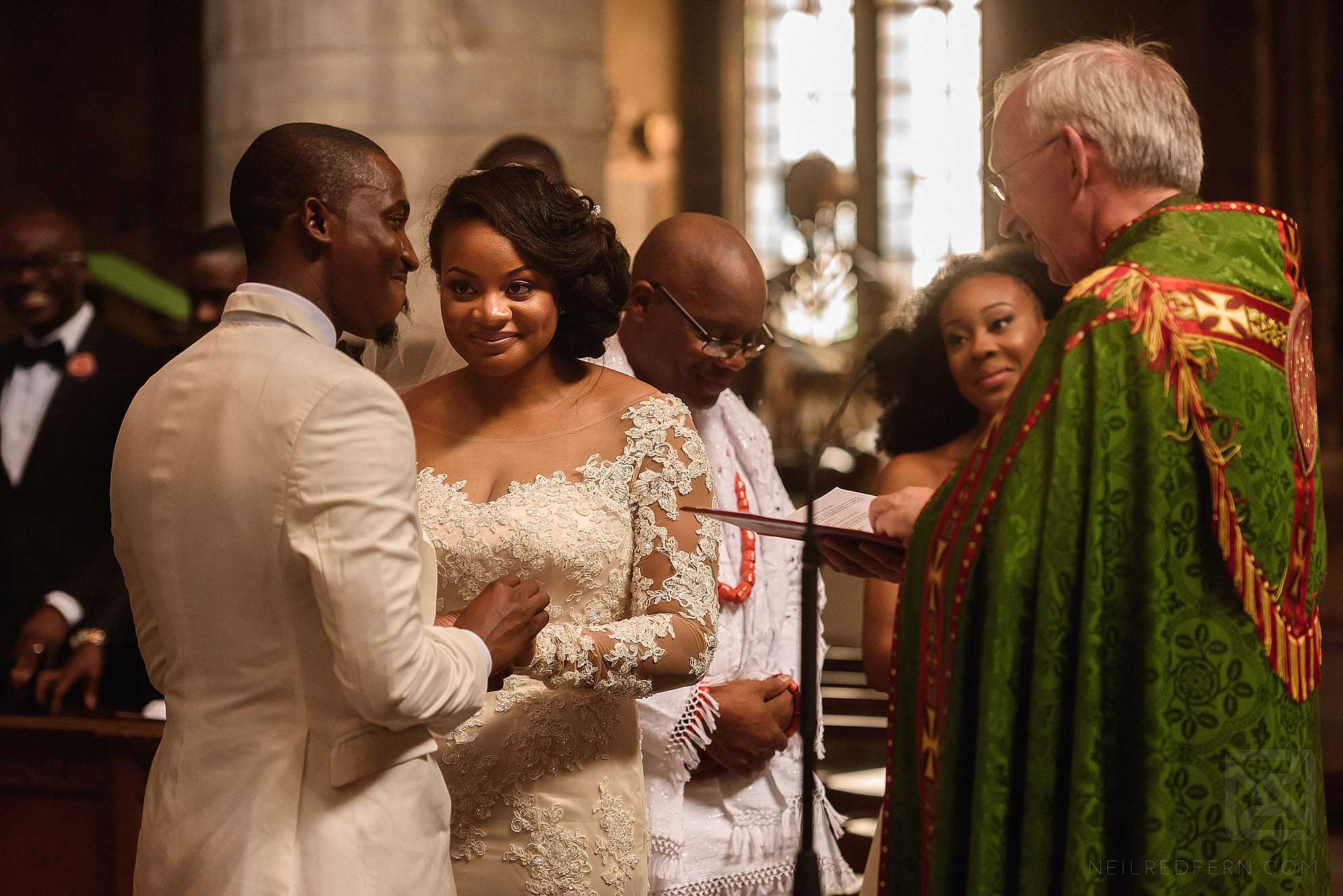 bride and groom saying vows during wedding ceremony