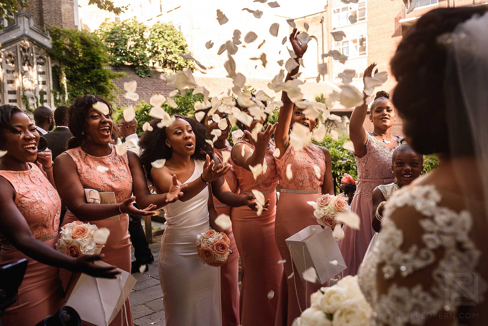 Bridesmaids throwing confetti