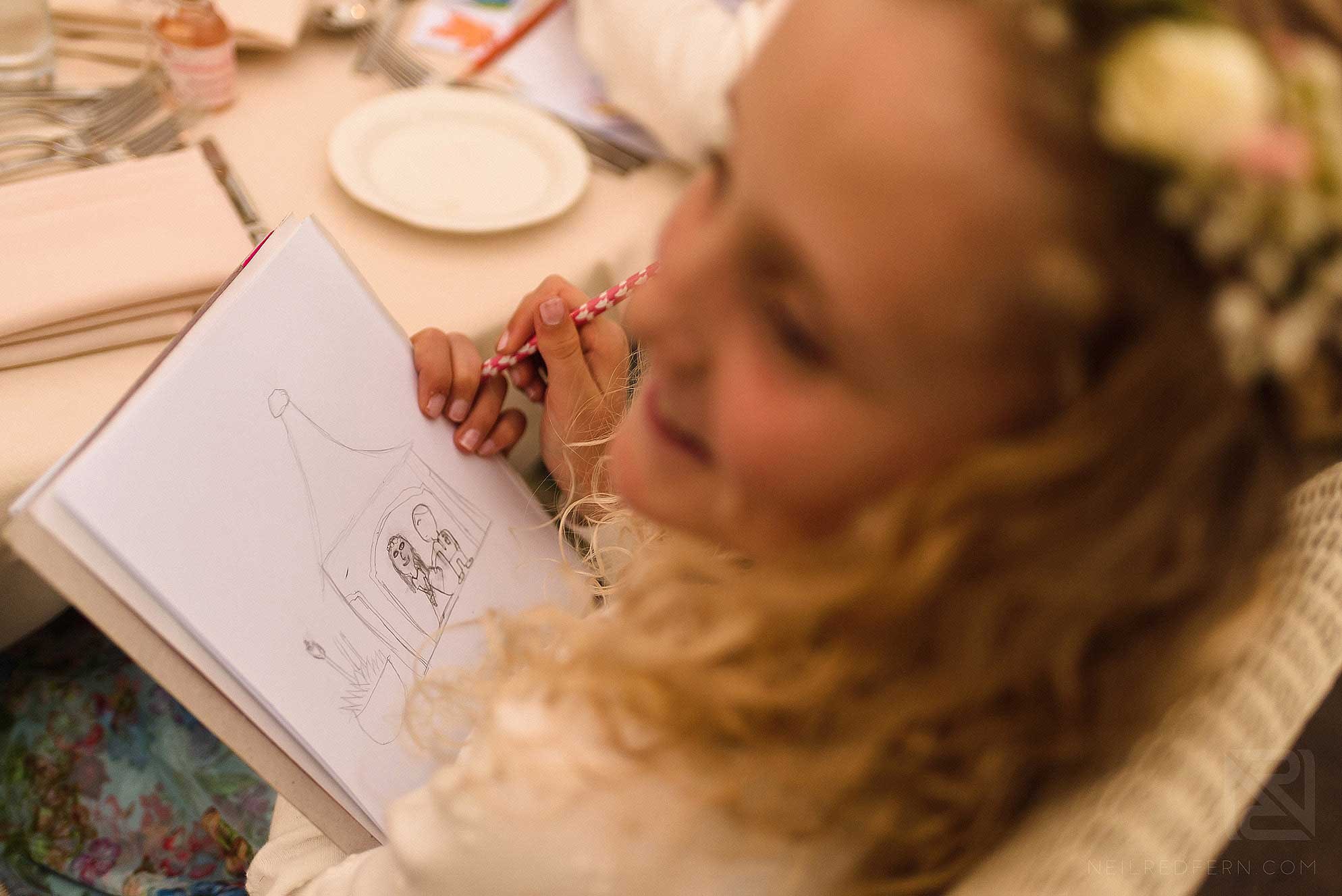 Abbeywood Estate wedding photography 20 flower girl drawing a picture
