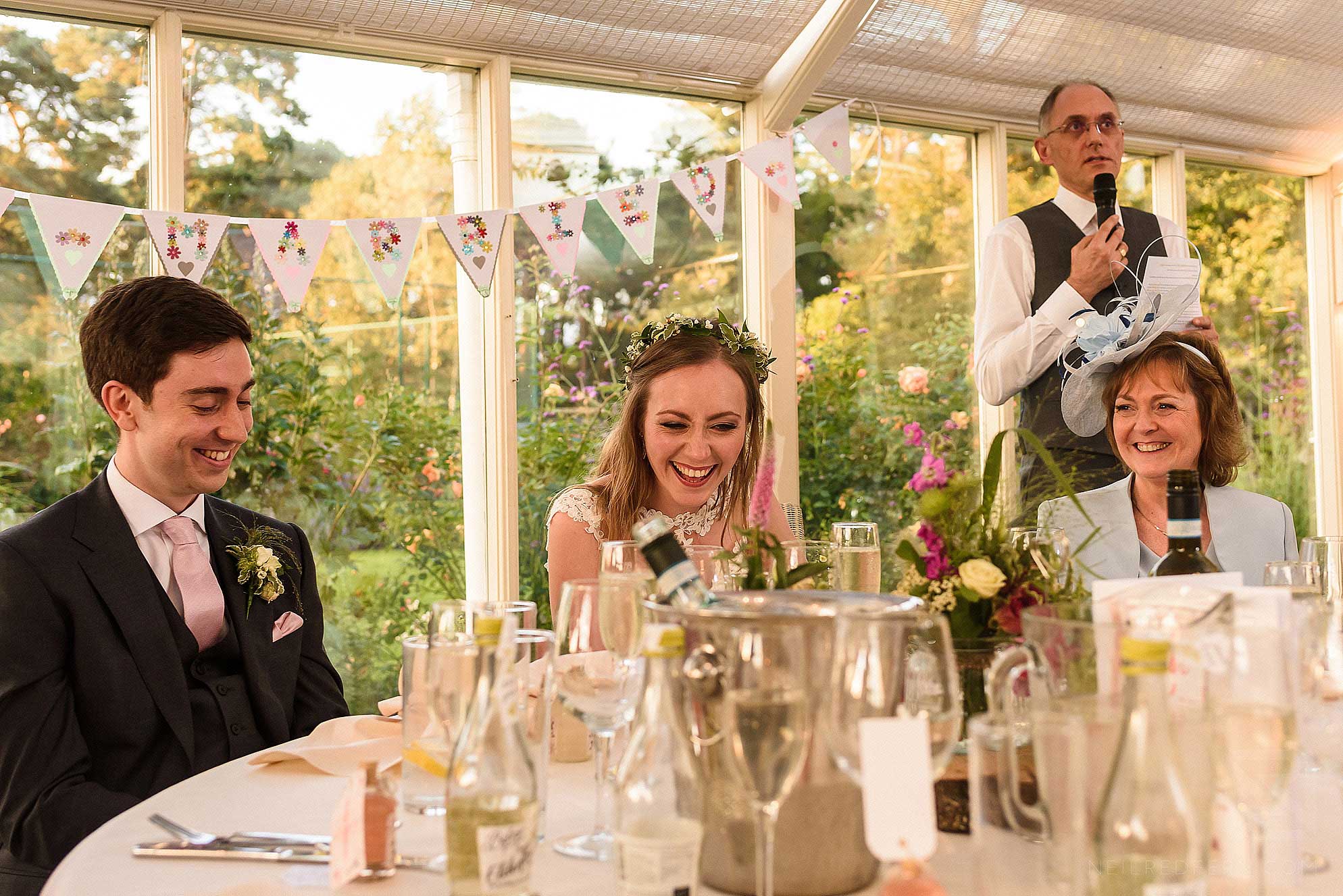 Abbeywood Estate wedding photography 26 top table laughing during speeches