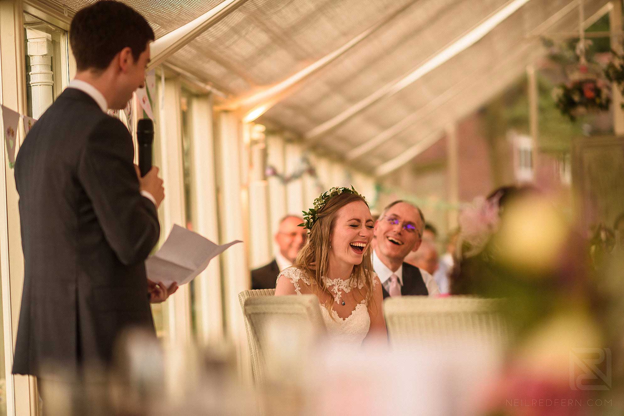 Abbeywood Estate wedding photography 29 bride laughing during speeches
