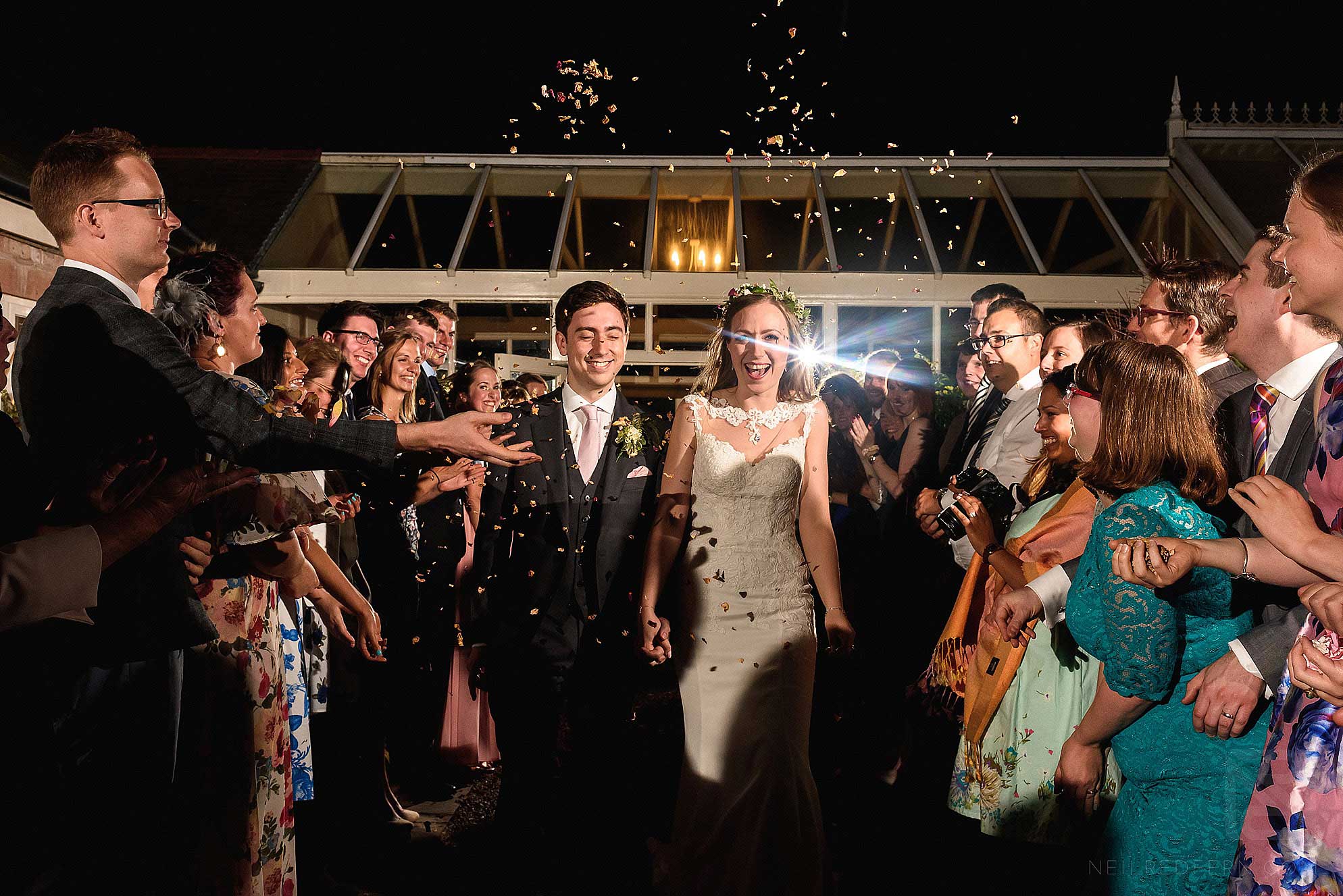 Abbeywood Estate wedding photography 34 throwing confetti in the dark