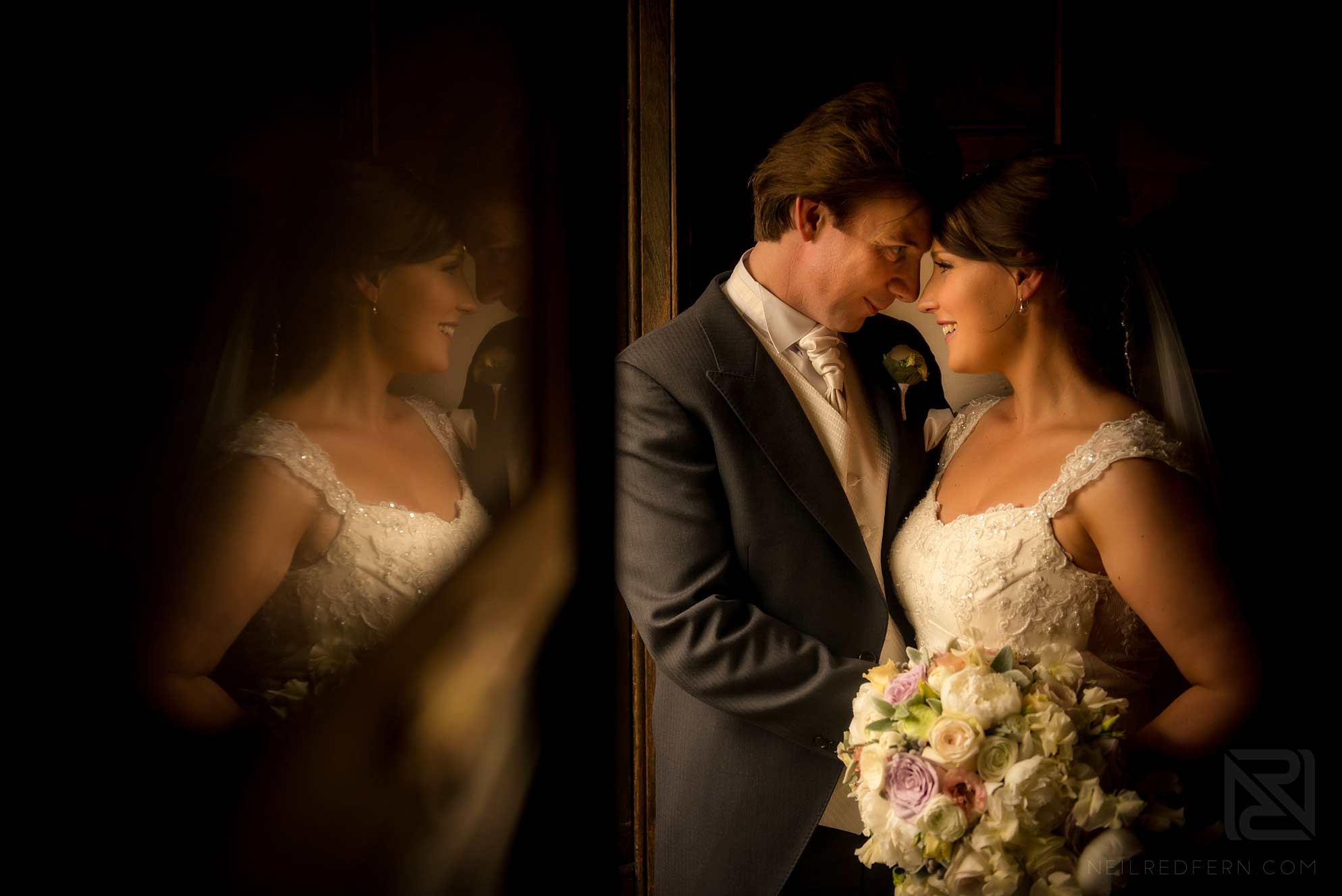 photograph of bride and groom with reflection in mirror