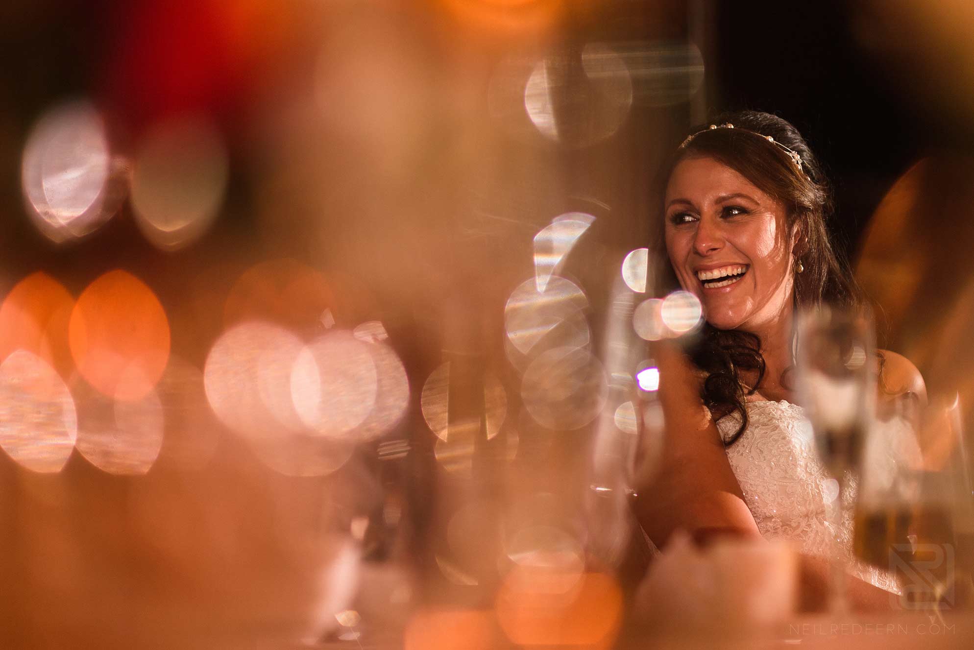 bride laughing during speeches