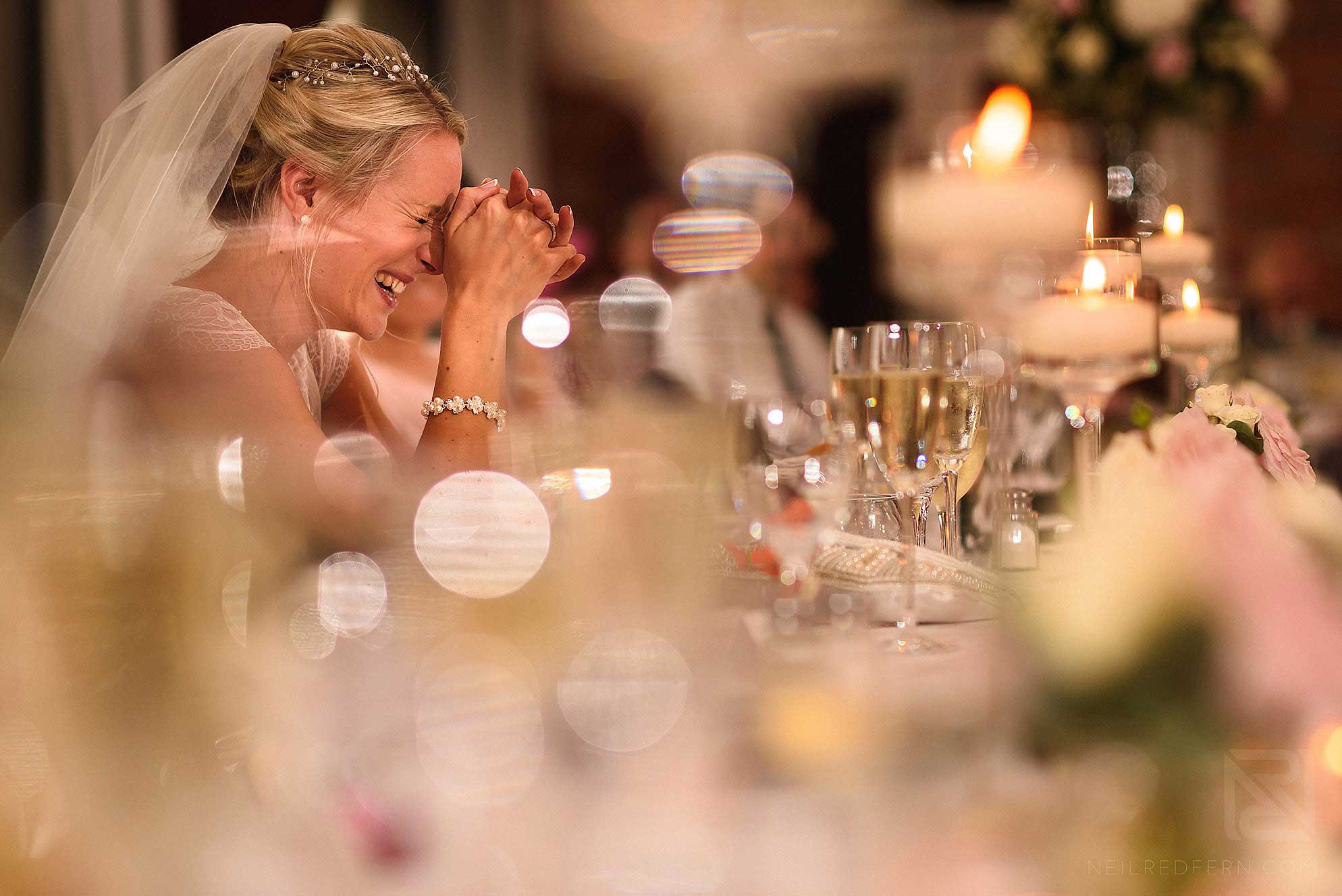 bride laughing during speeches