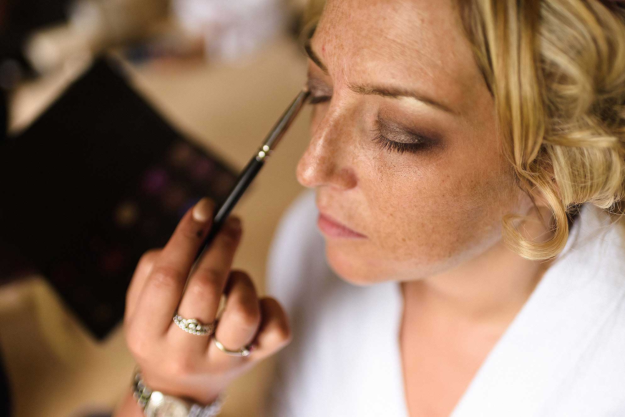 bride having make-up done