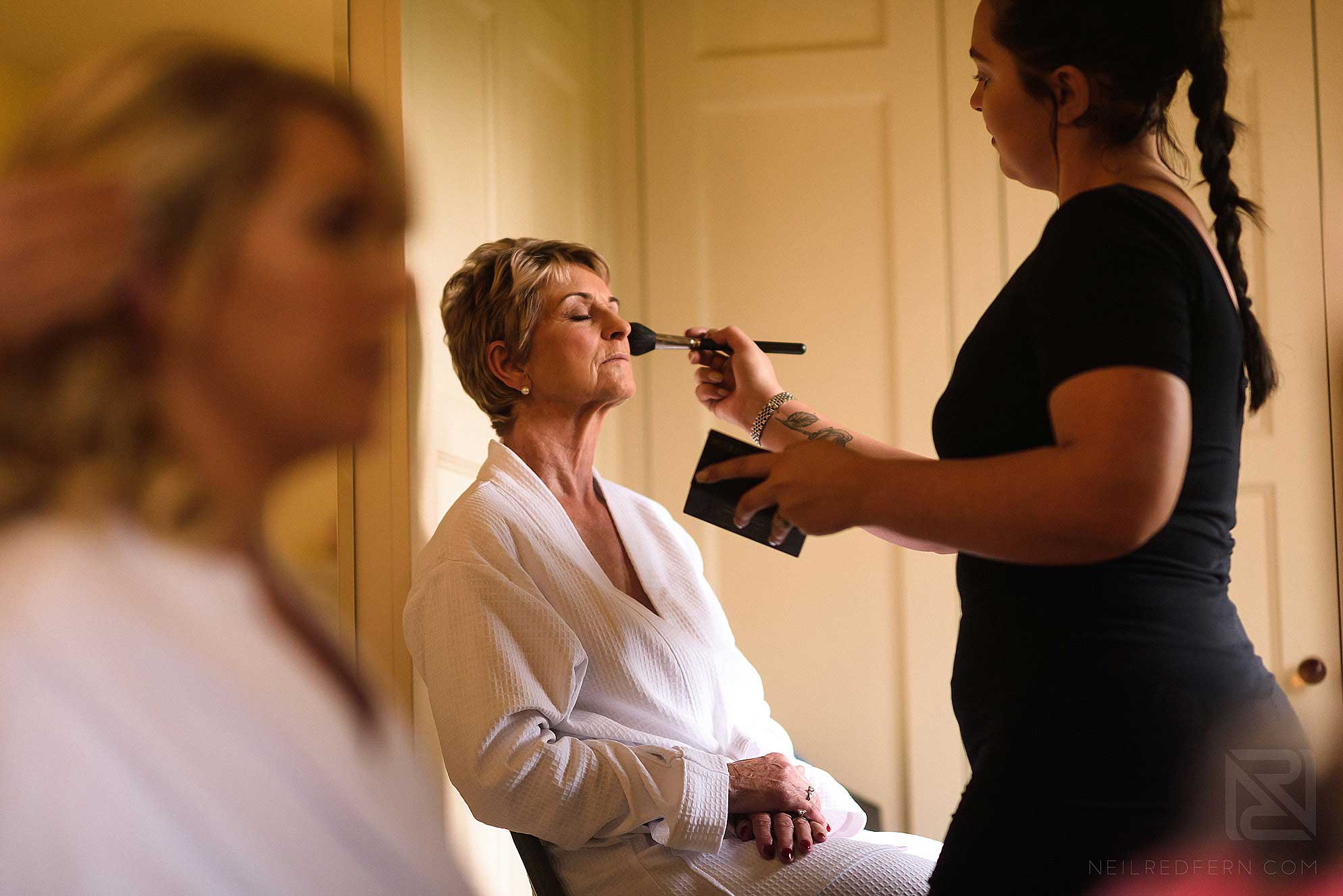 mother of bride having make-up done