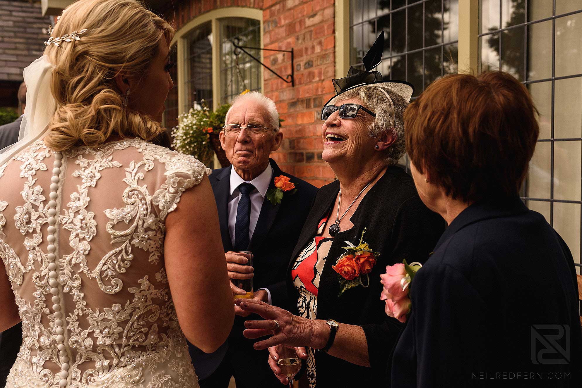 laughing wedding guests