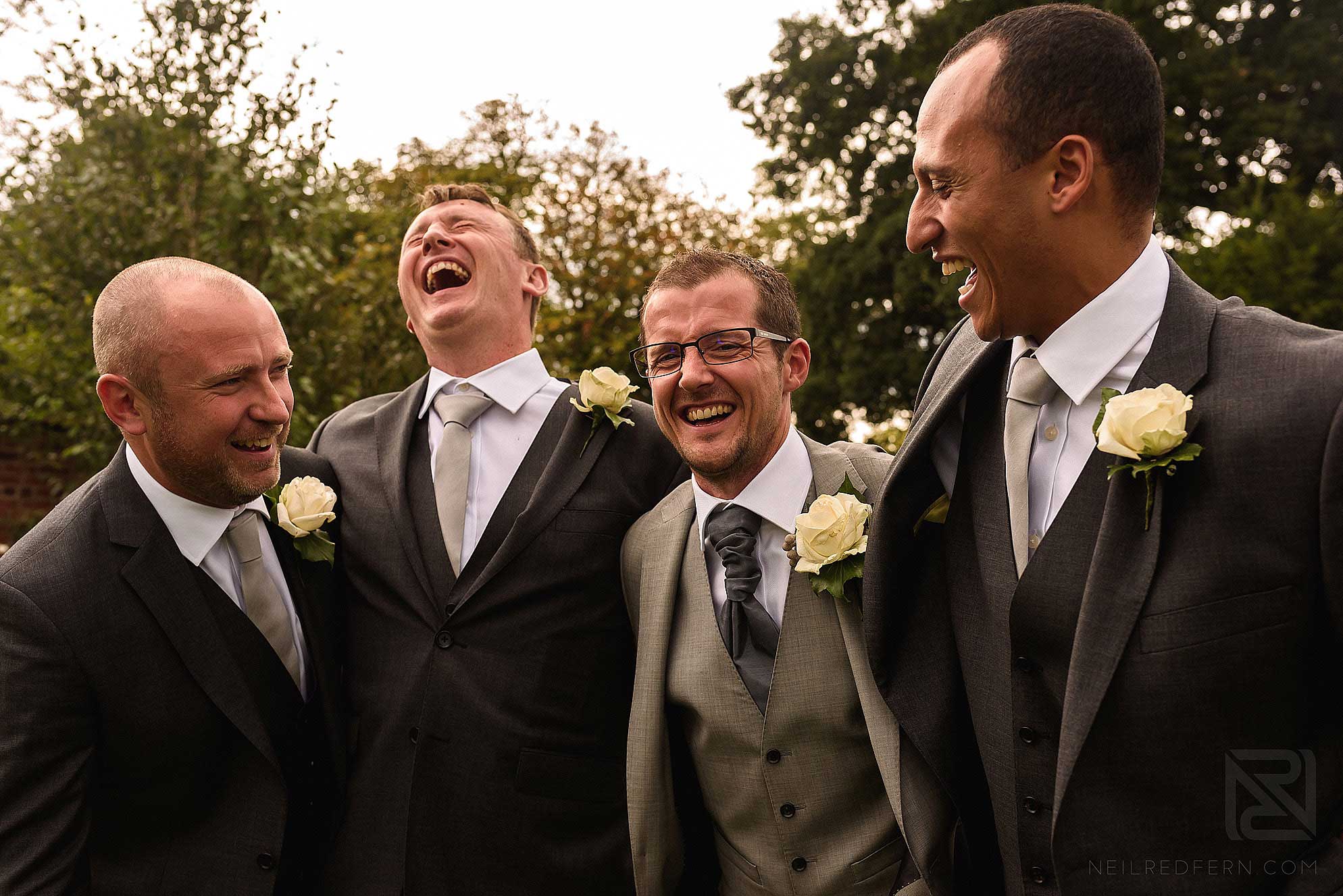 happy groomsmen at wedding