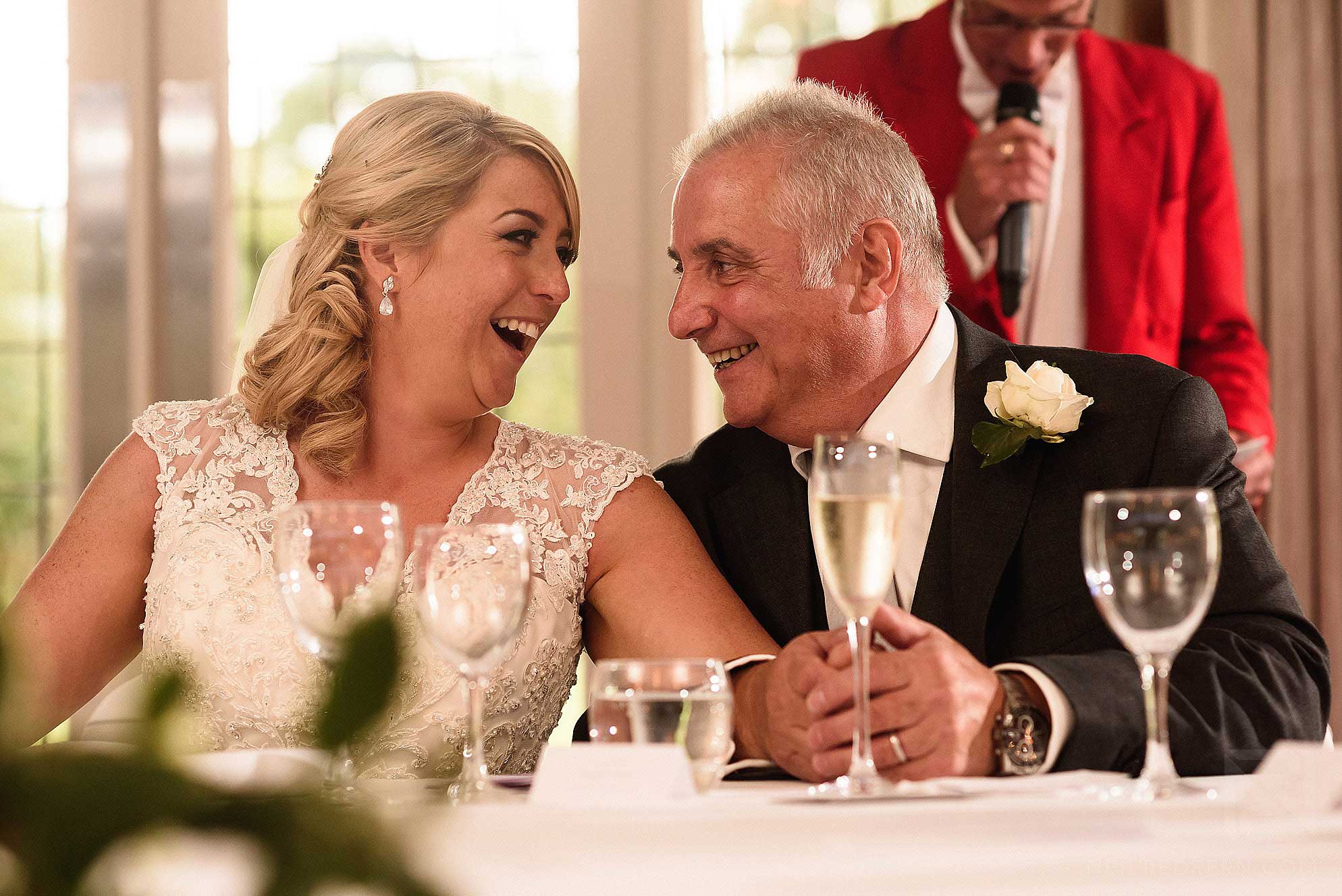 father of bride and daughter during speeches