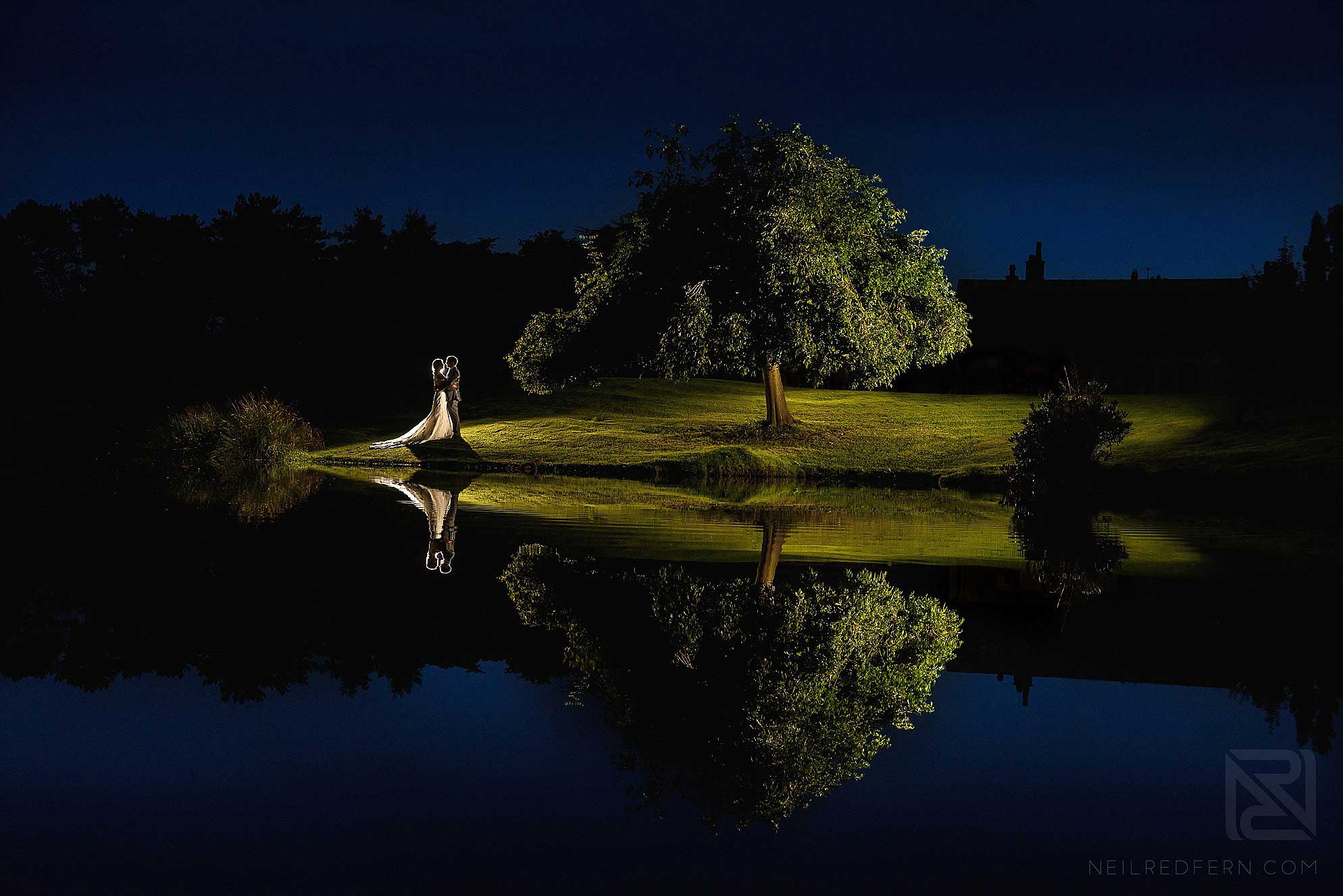 romantic evening photo of bride and groom by tree at Colshaw Hall