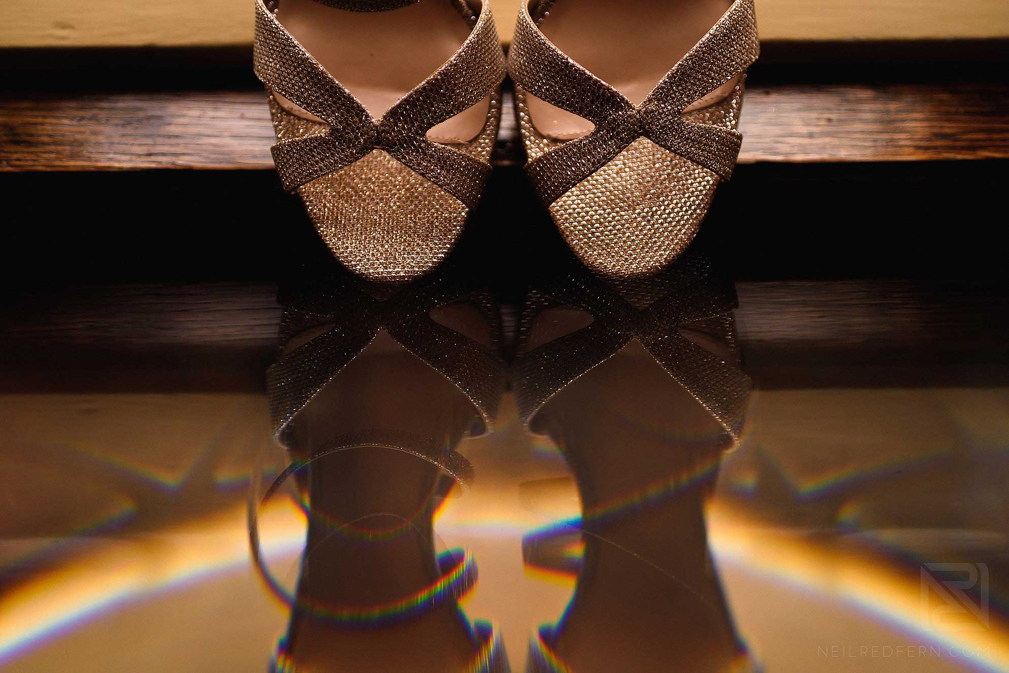creative photograph of wedding shoes