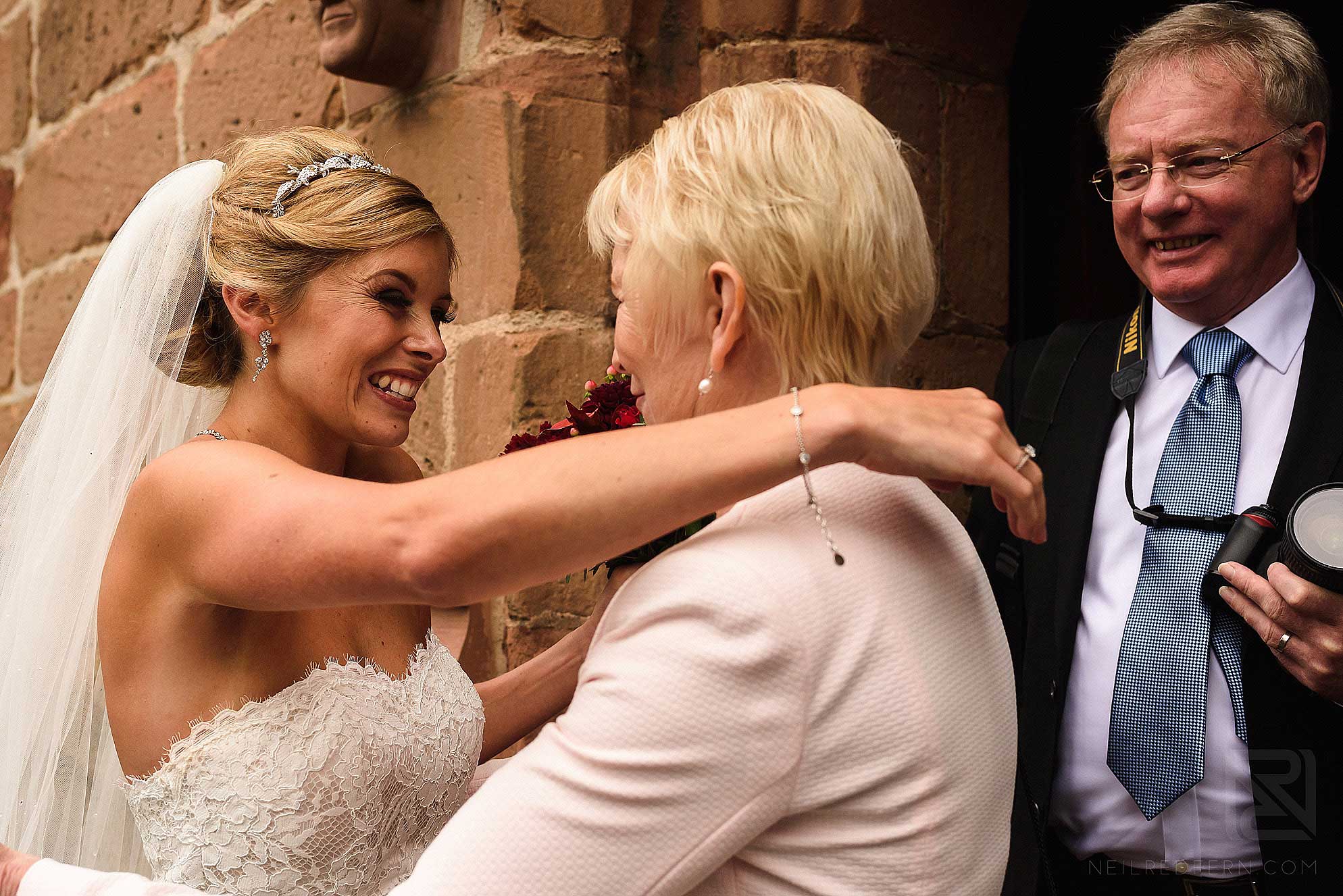bride and guest smiling