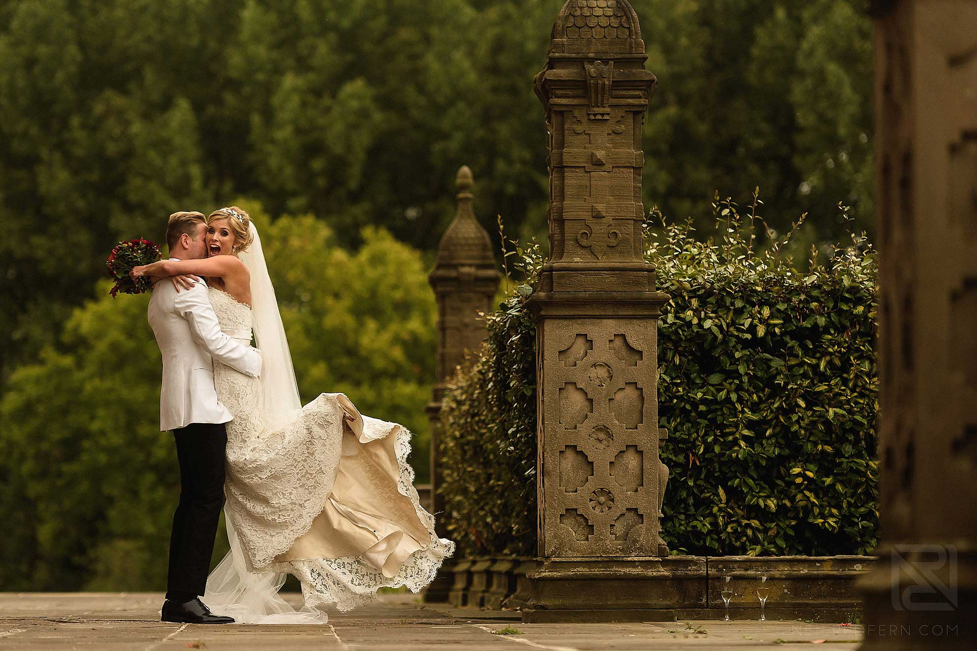 groom picking up bride