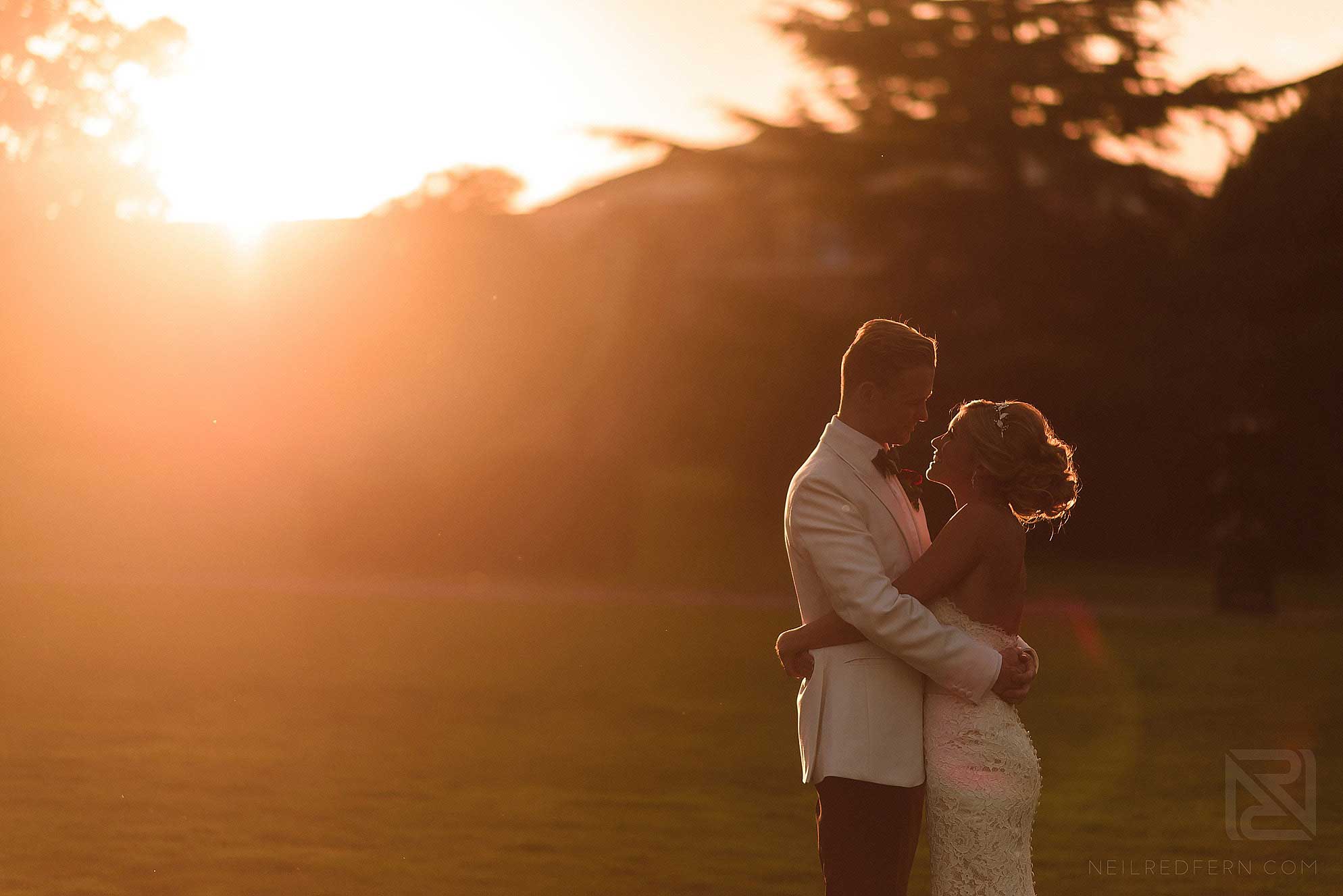 bride and groom together at sunset