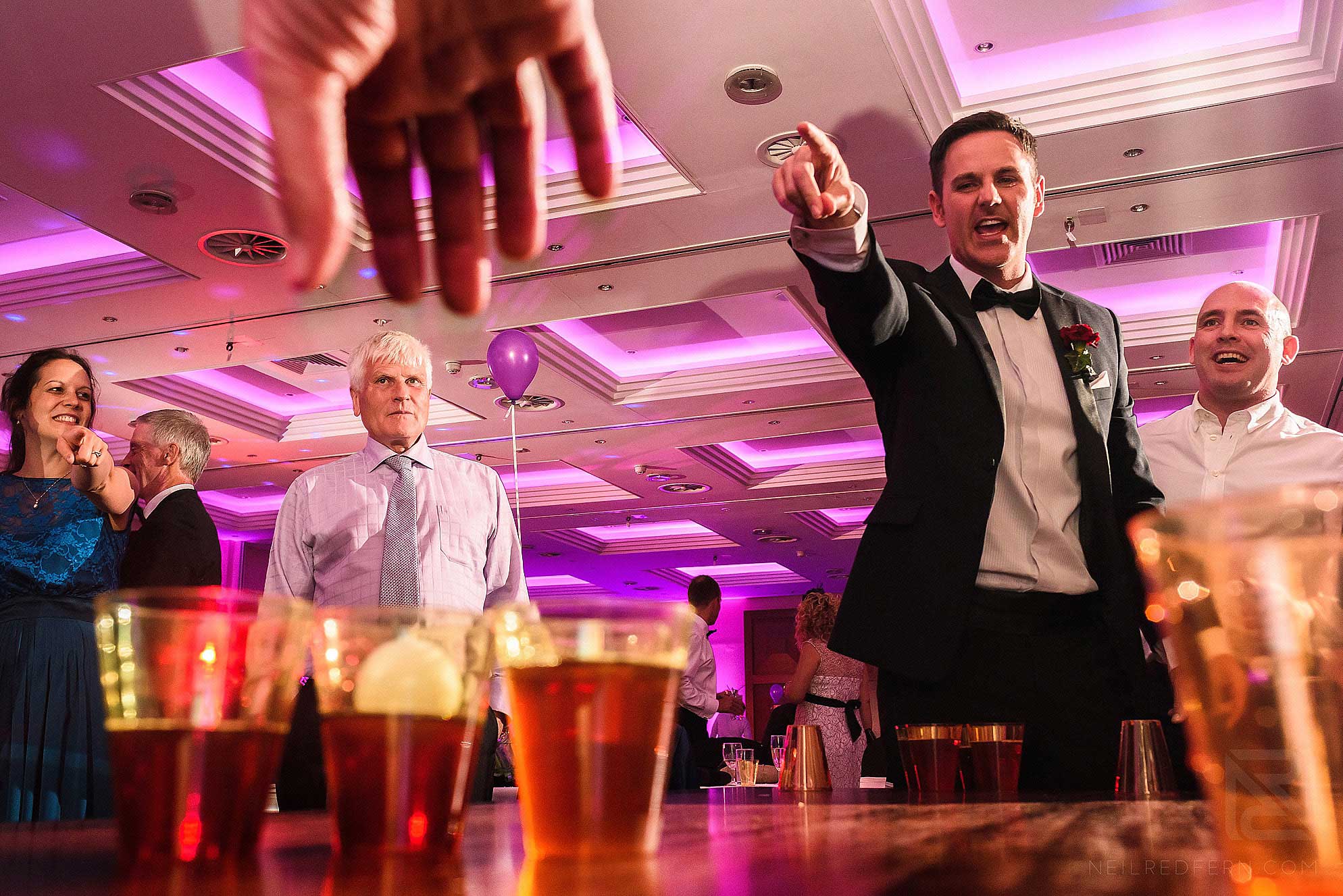 guests playing beer pong at wedding