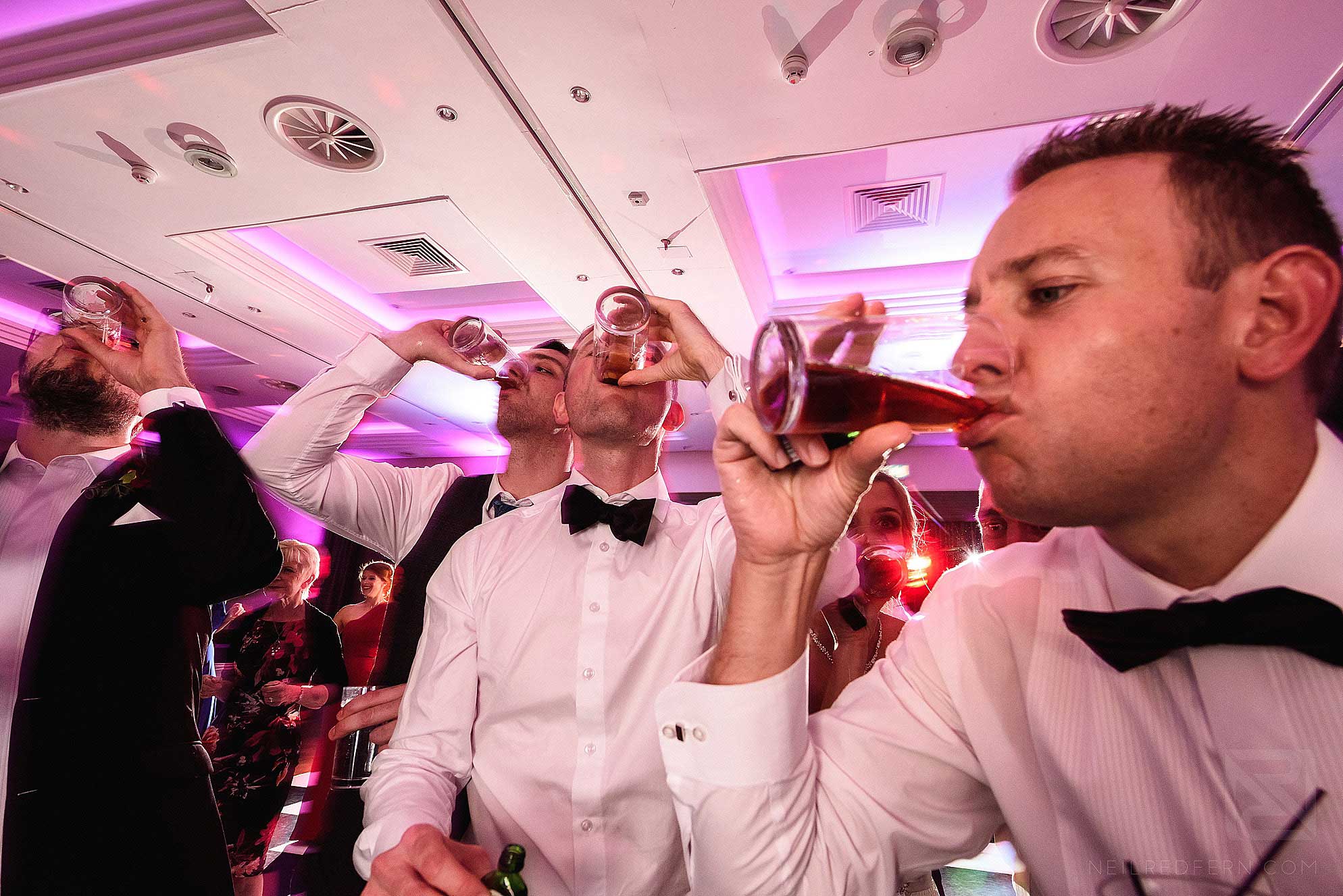 groomsmen drinking shots