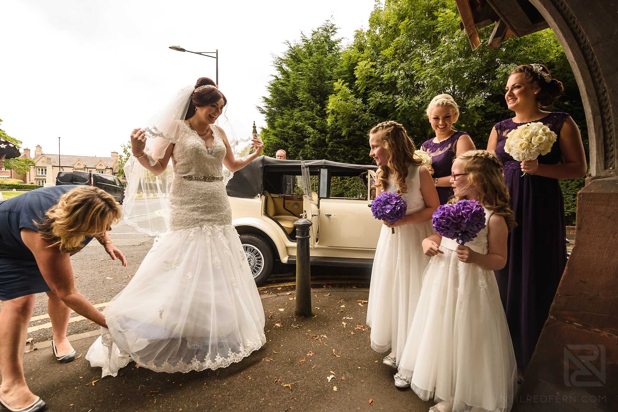 Knowsley Hall summer wedding 7 bride and bridesmaids by car