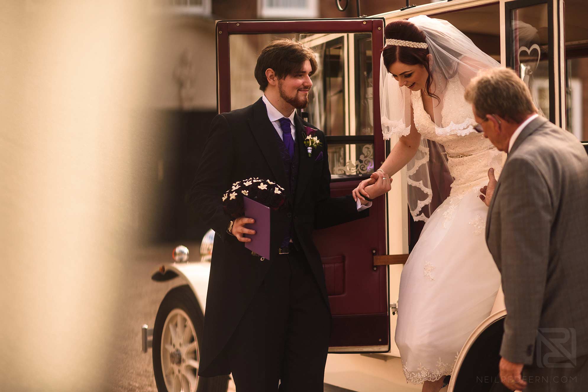 Knowsley Hall summer wedding 19 bride getting out of car