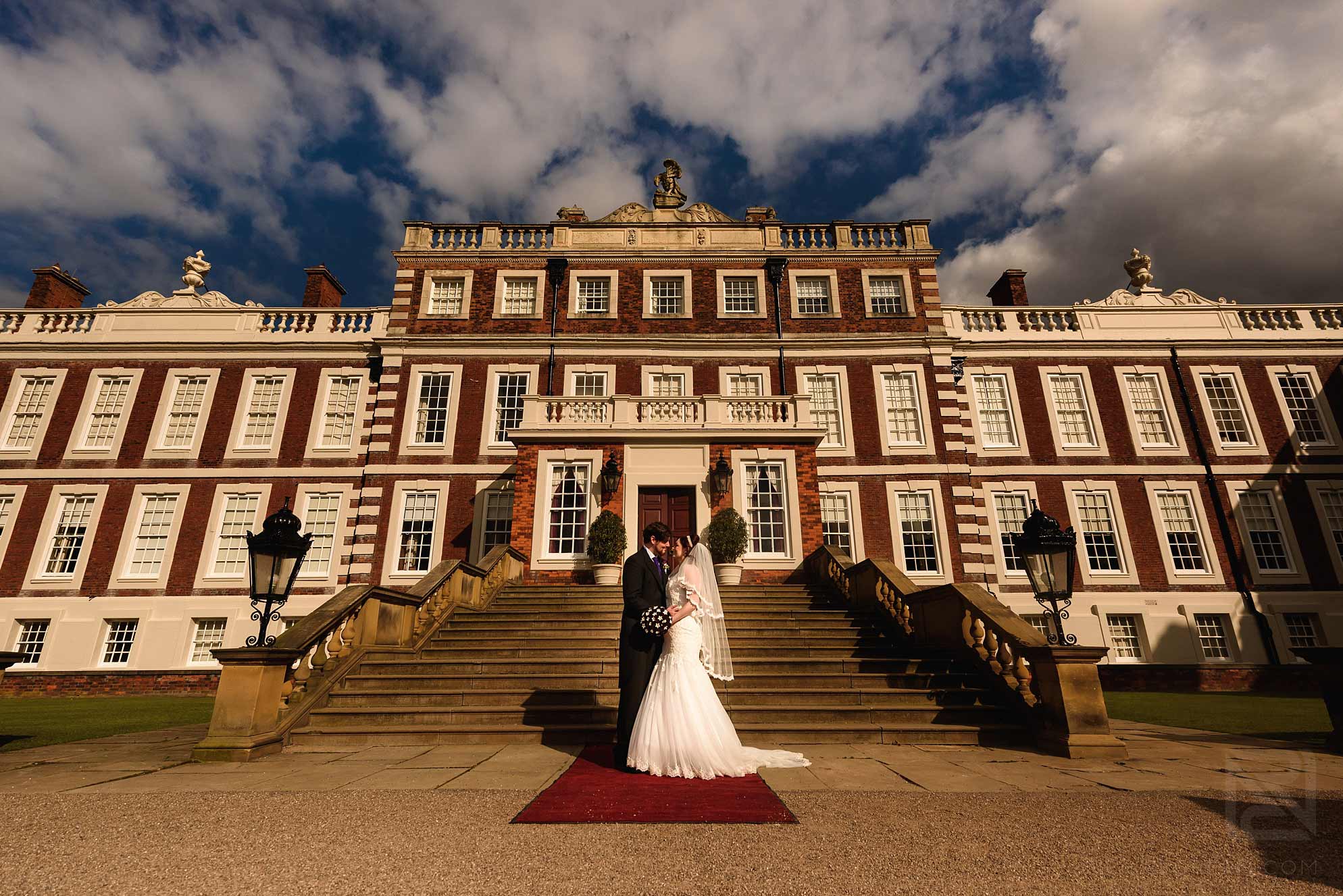 Knowsley Hall summer wedding 20 bride and groom stood outside Knowsley Hall