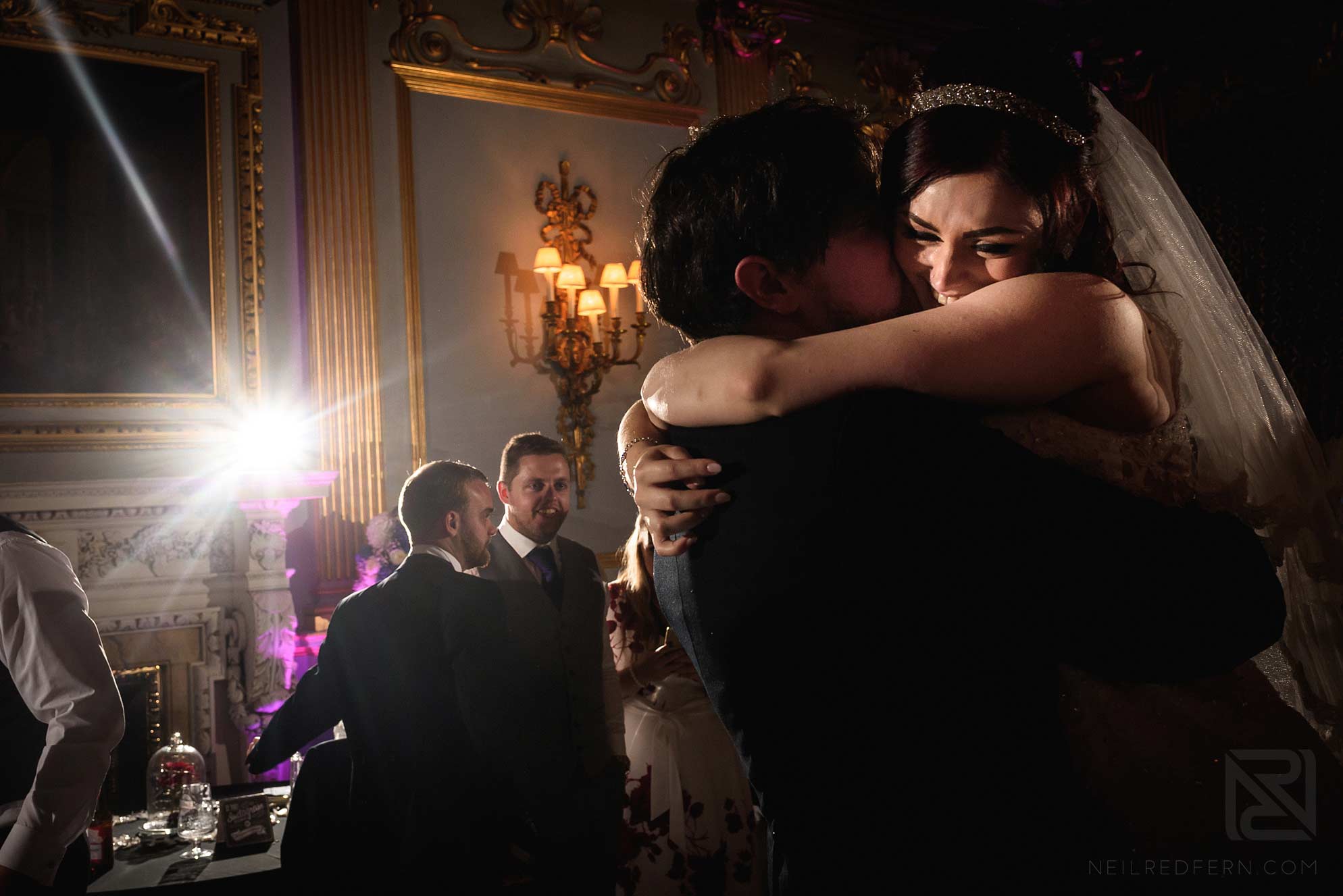 Knowsley Hall summer wedding 31 bride hugging groom on dancefloor