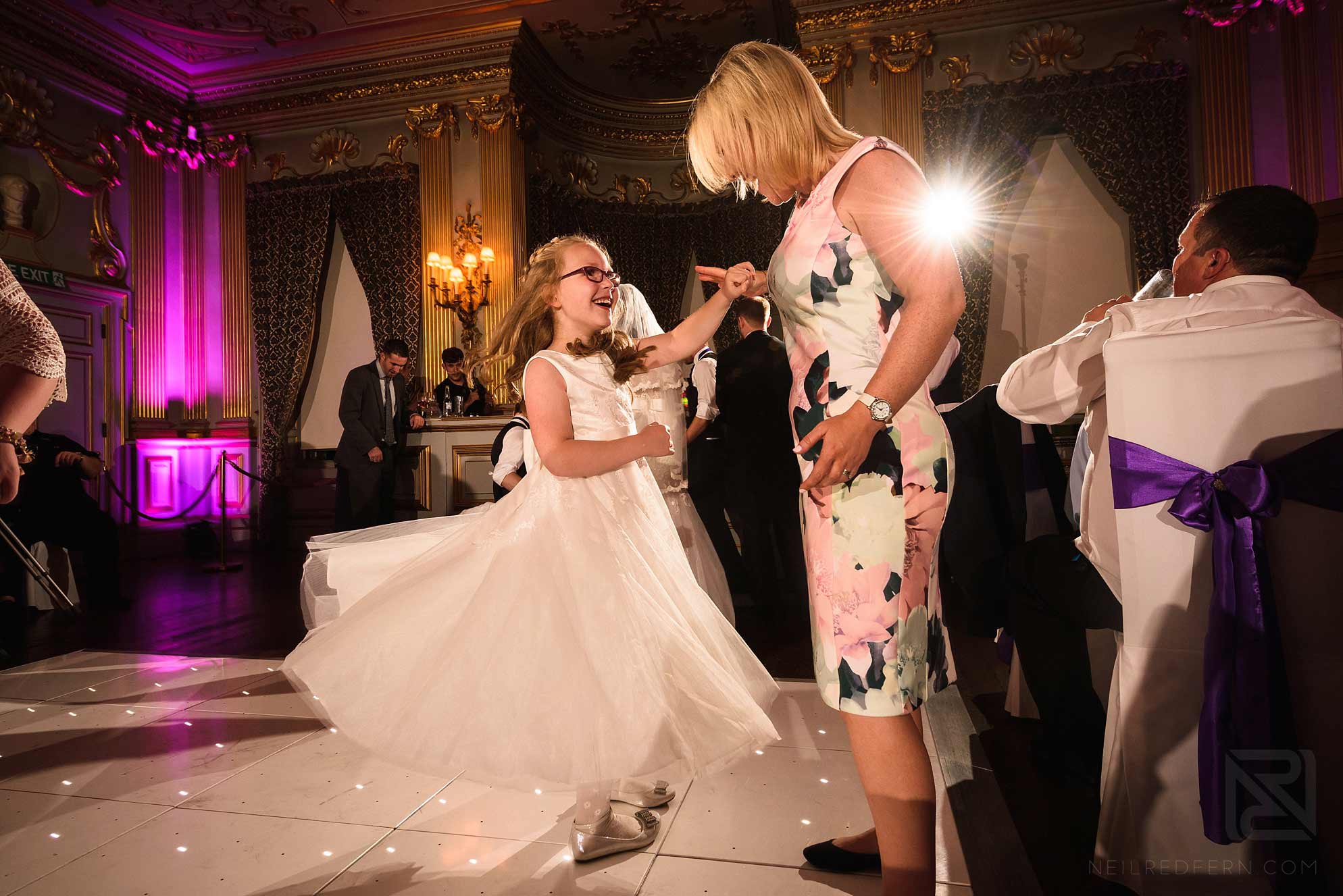 Knowsley Hall summer wedding 32 flower girl dancing