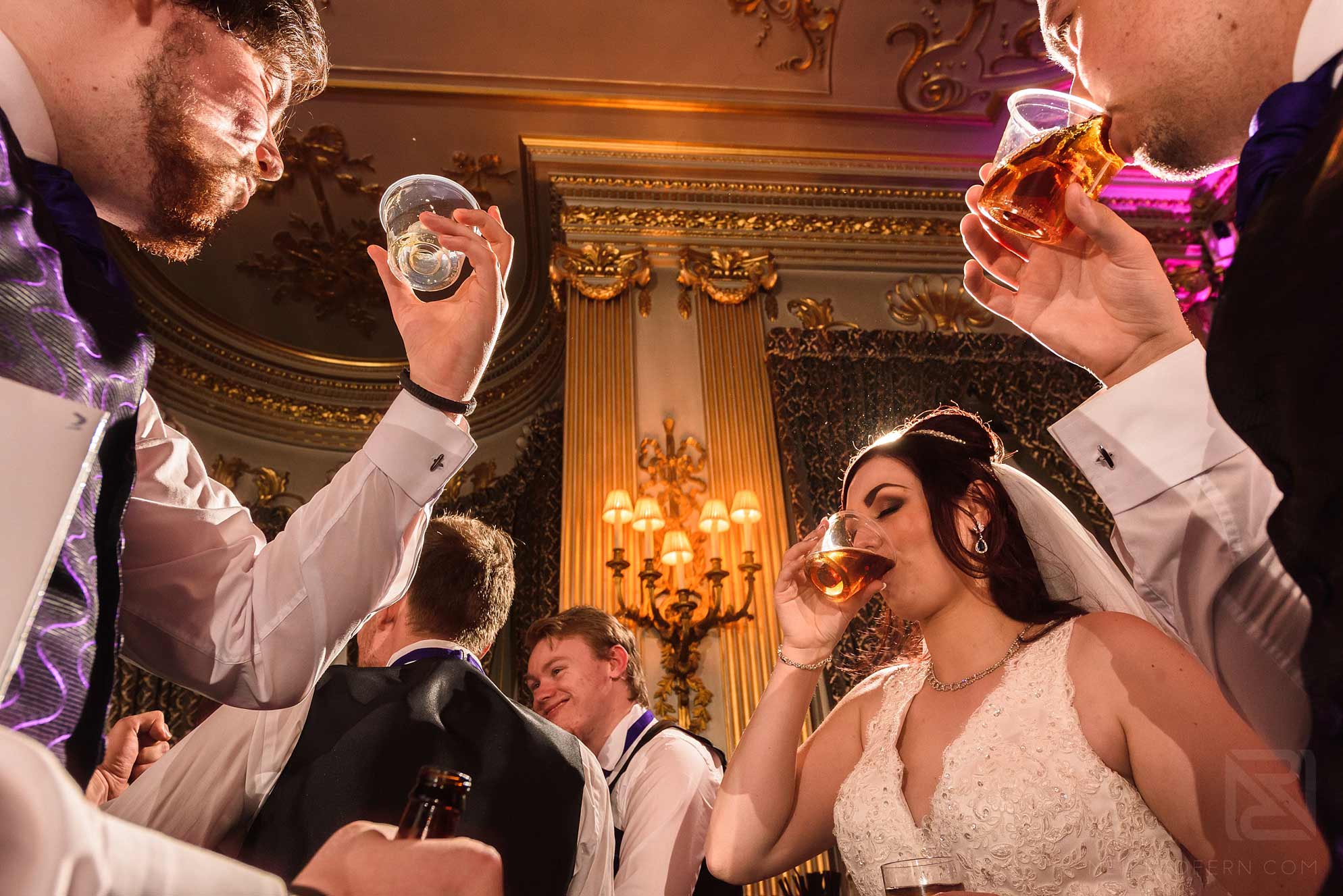 Knowsley Hall summer wedding 33 bride drinking shots