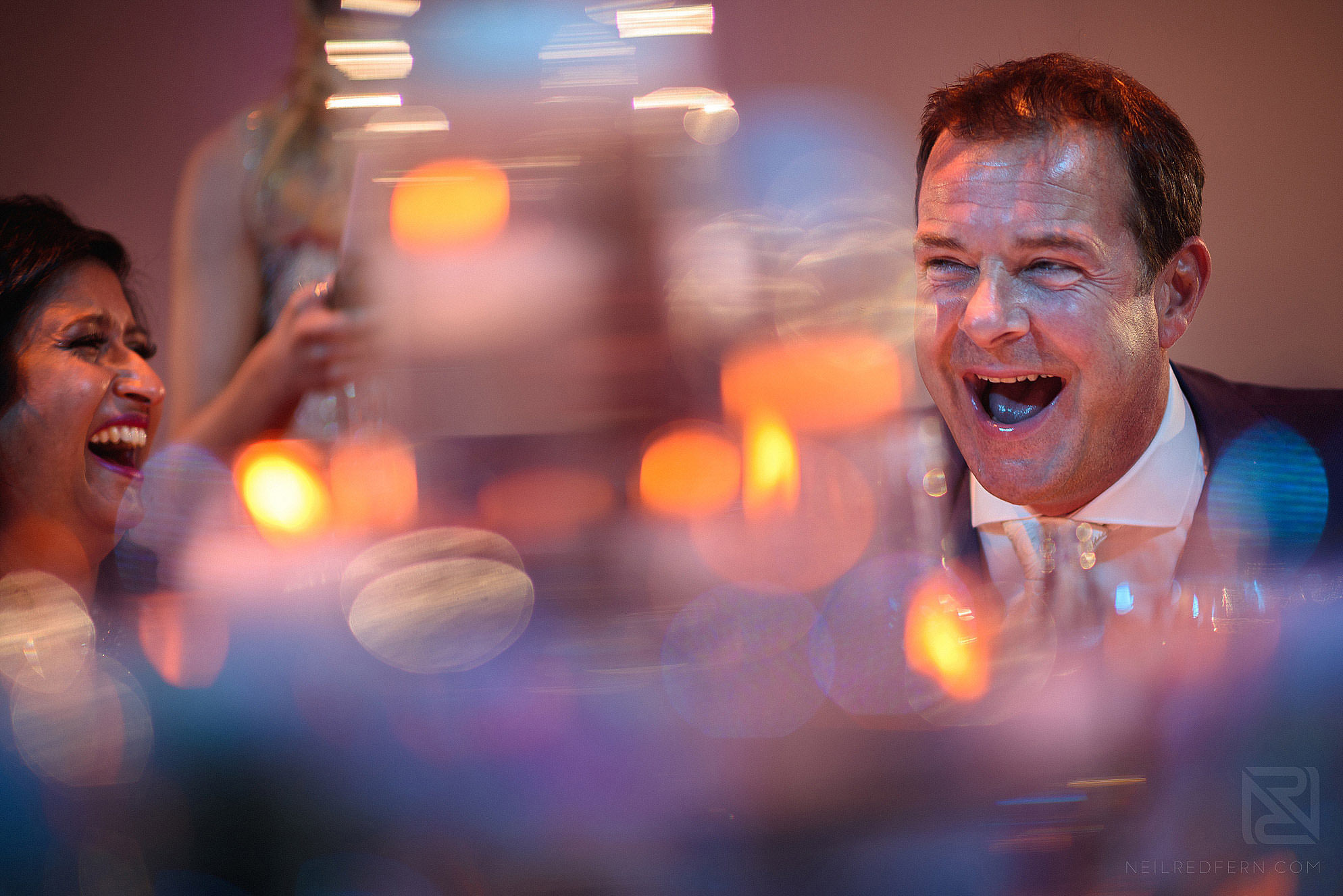 groom laughing during speeches