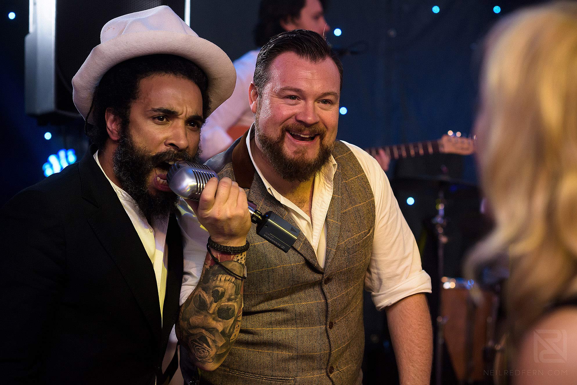 wedding guest singing with band