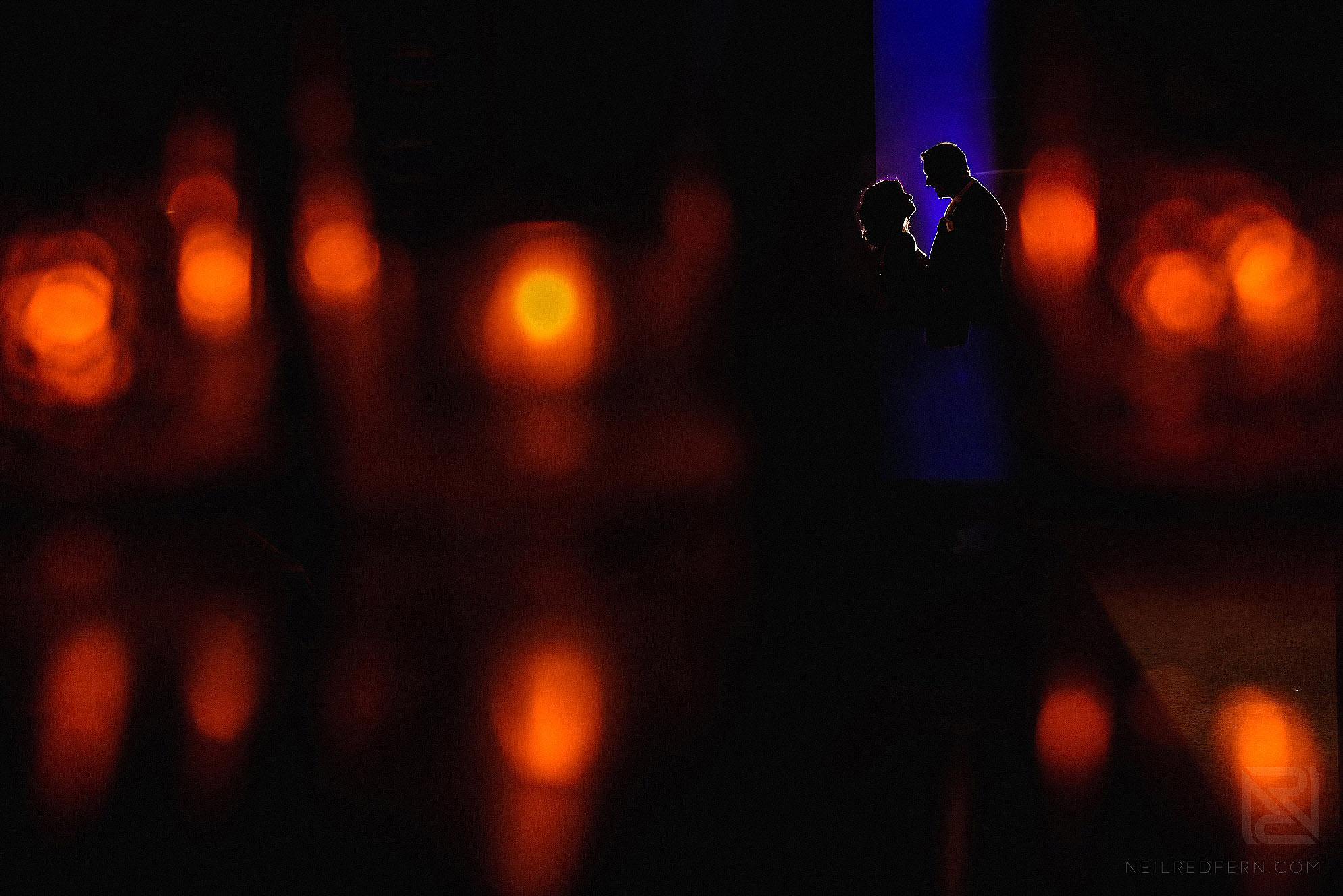 creative silhouette photograph of bride and groom at wedding