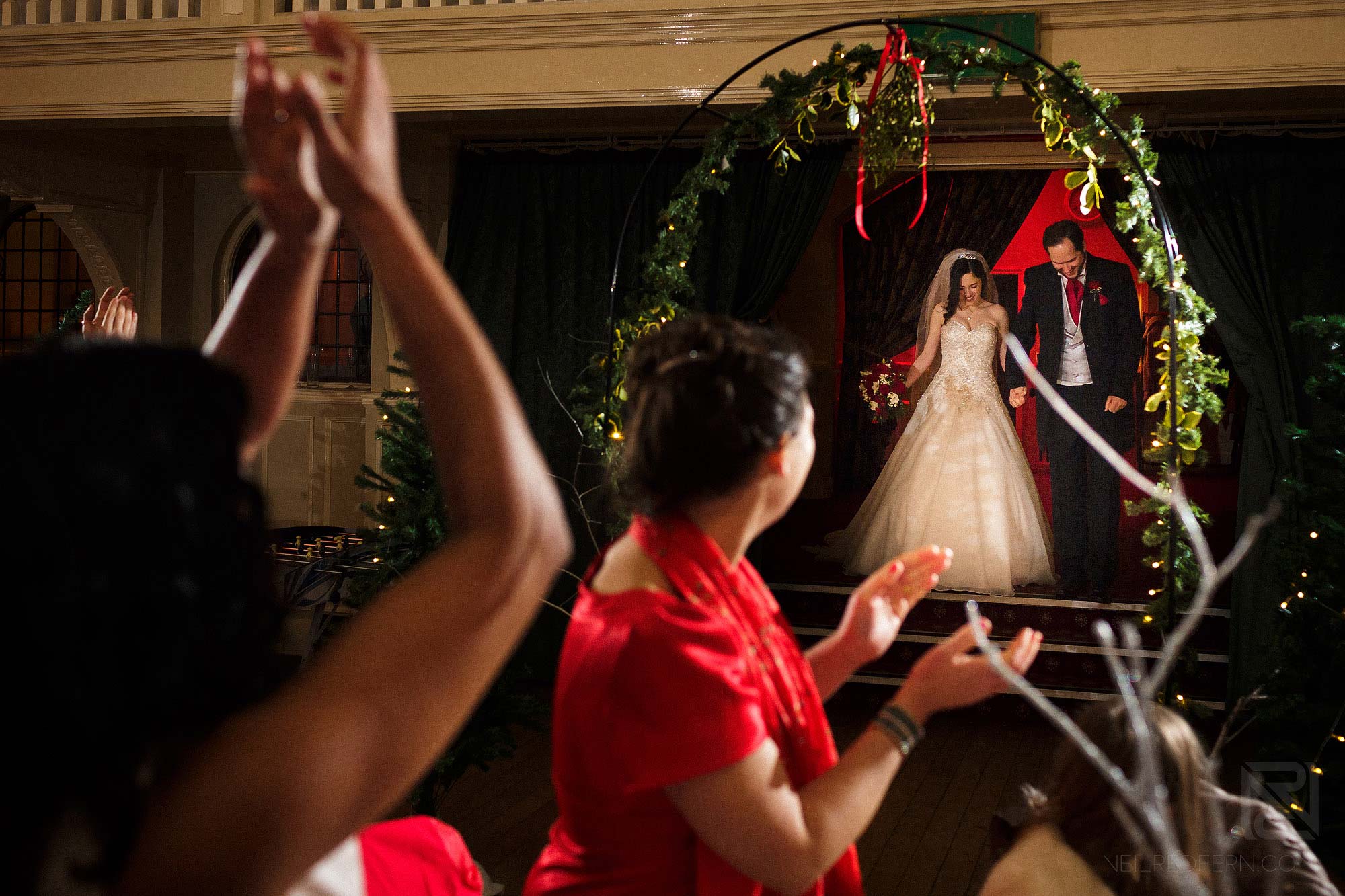 bride and groom being cheered in to room