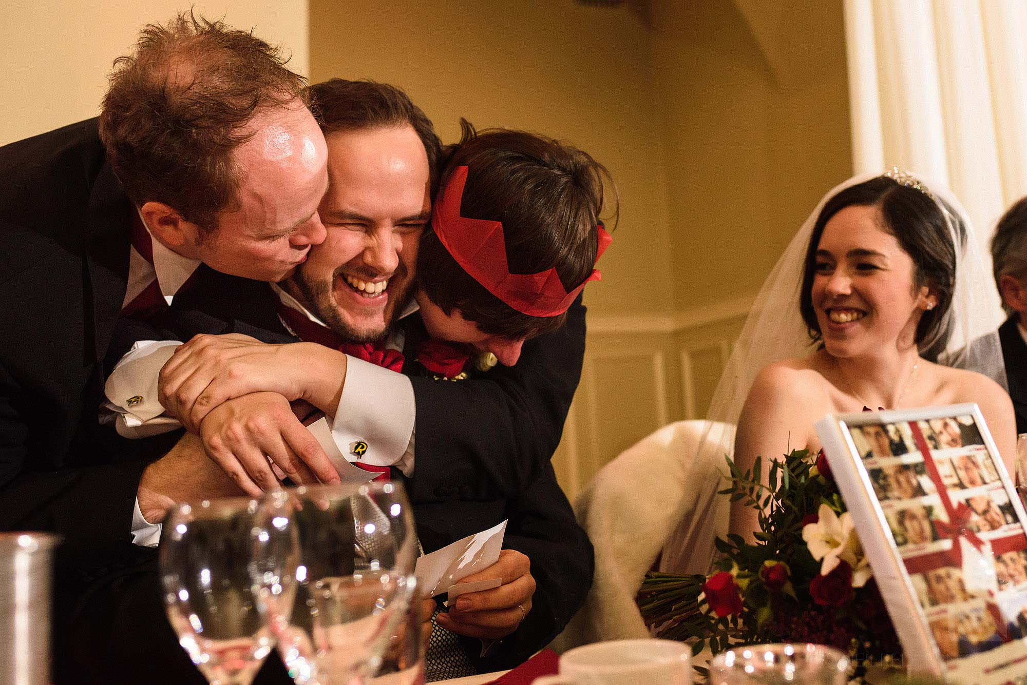 groomsmen kissing groom at wedding at The Bowdon Rooms