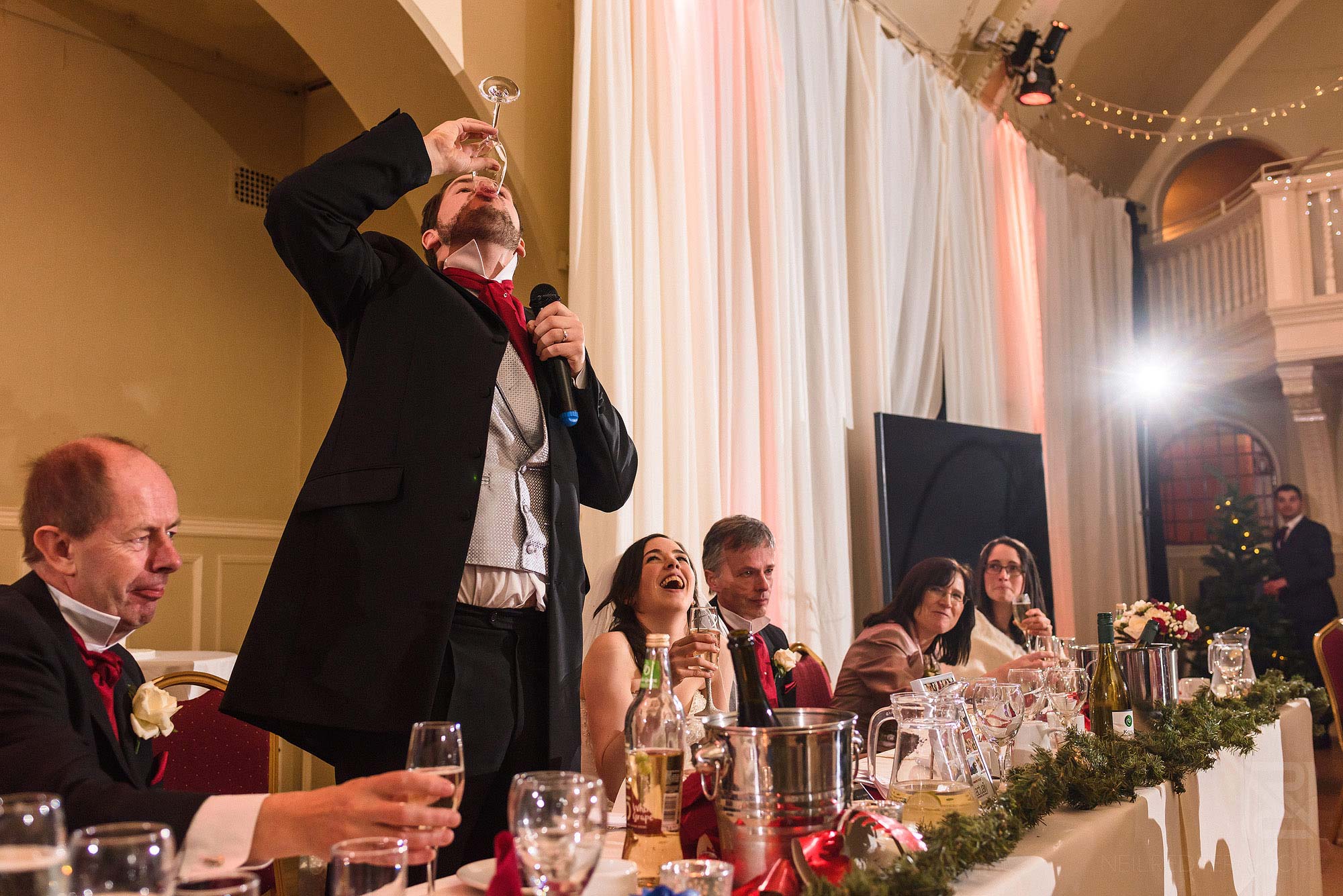 Groom downing drink during speech at The Bowdon Rooms