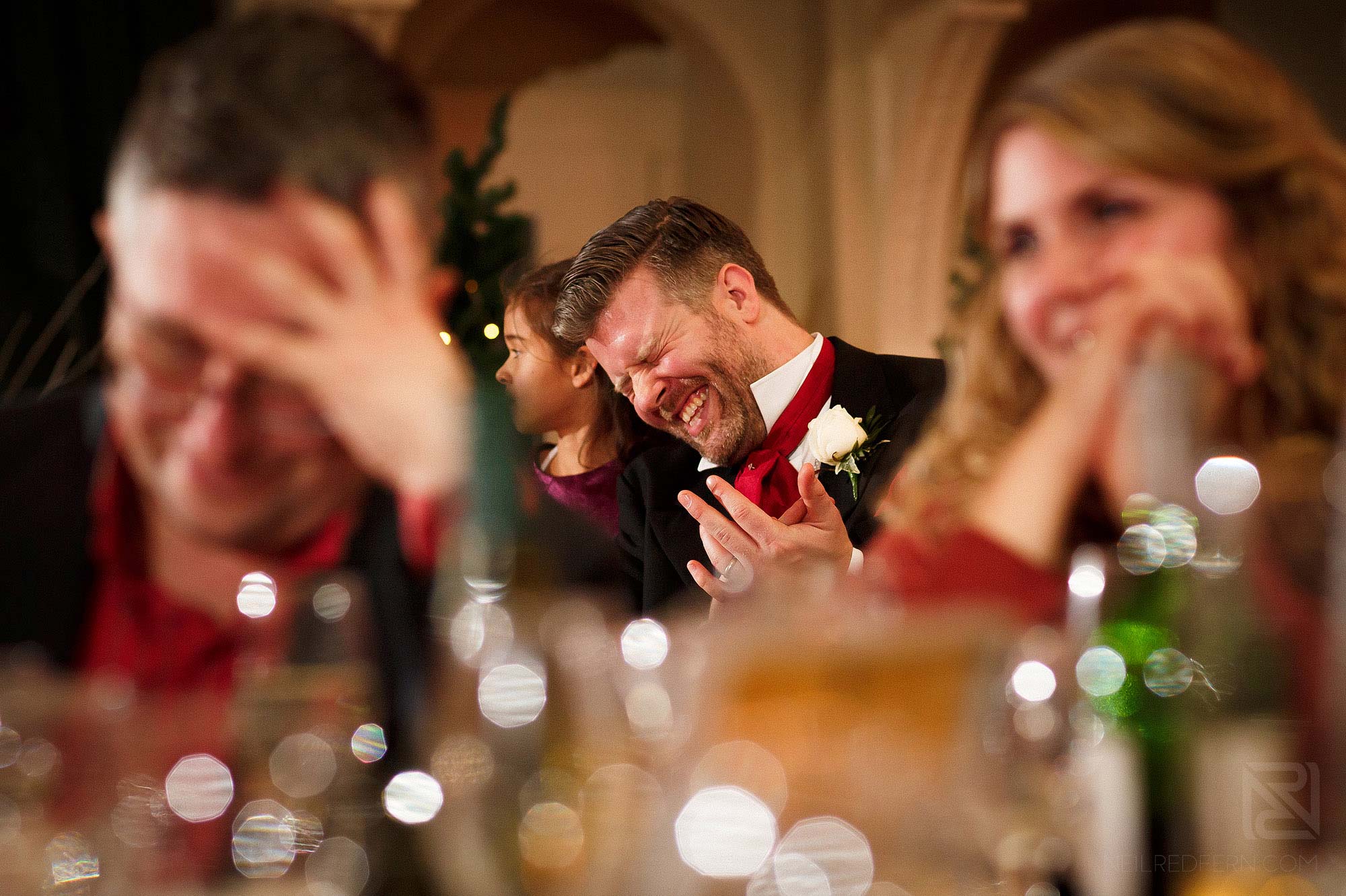 guests laughing during speeches