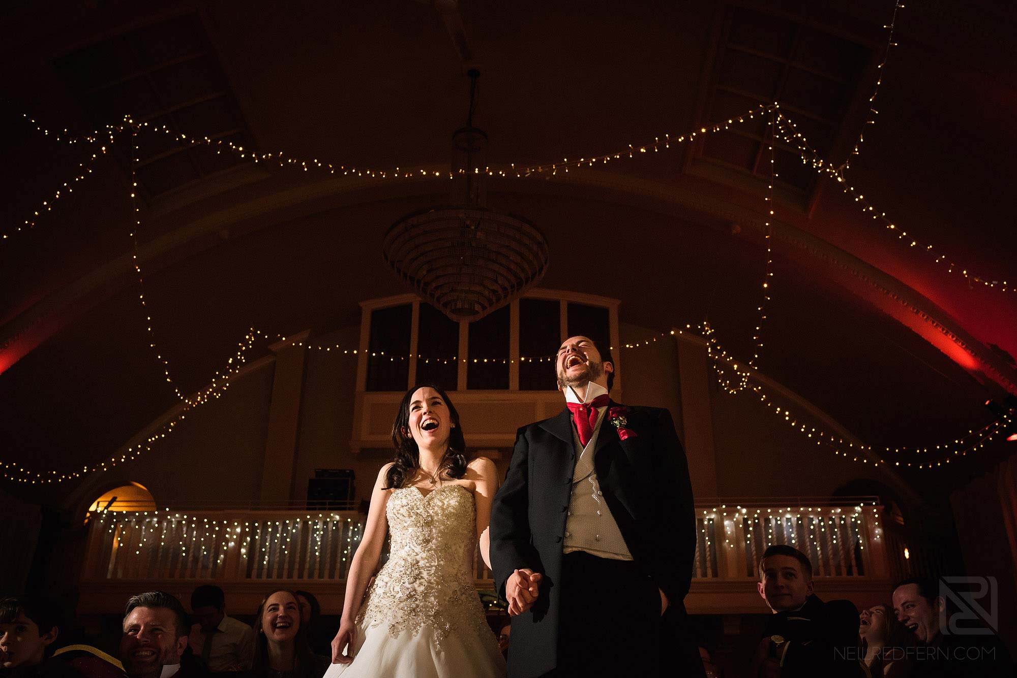bride and groom laughing together