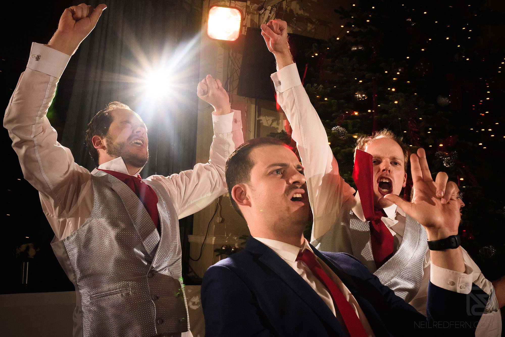 groomsmen dancing at wedding