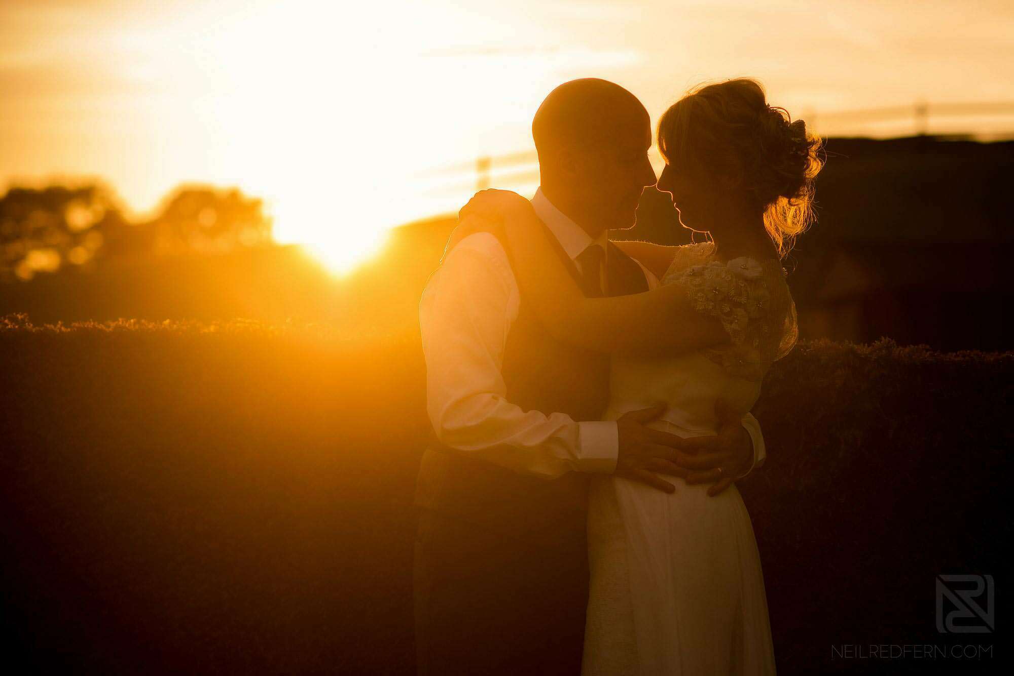 beautiful sunset photograph of bride and groom