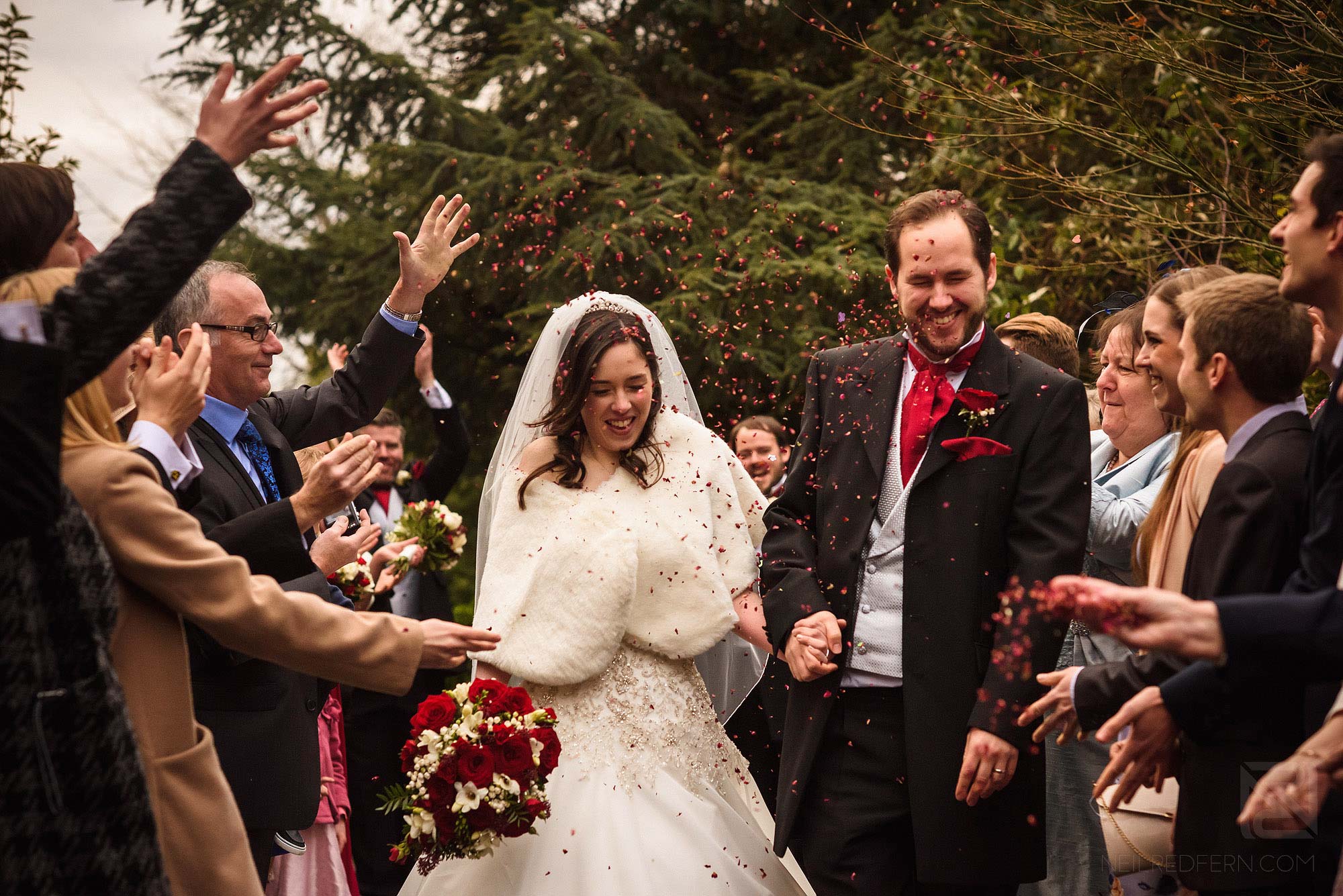 wedding guests throwing confetti