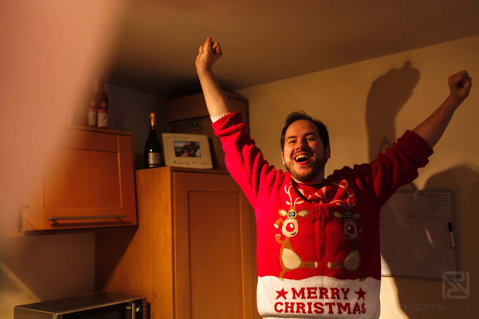 happy groom on morning of wedding