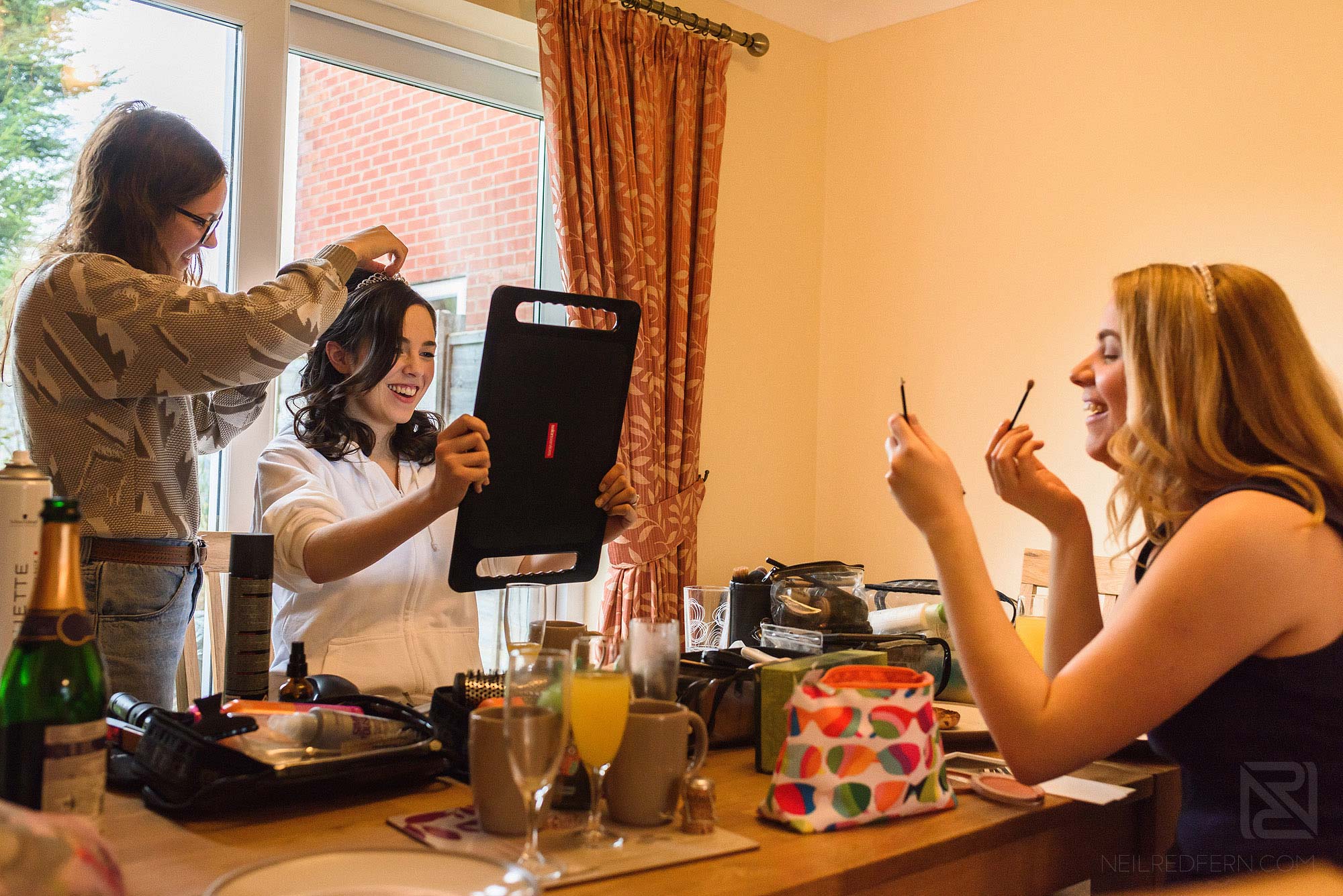 bride and bridesmaids getting ready