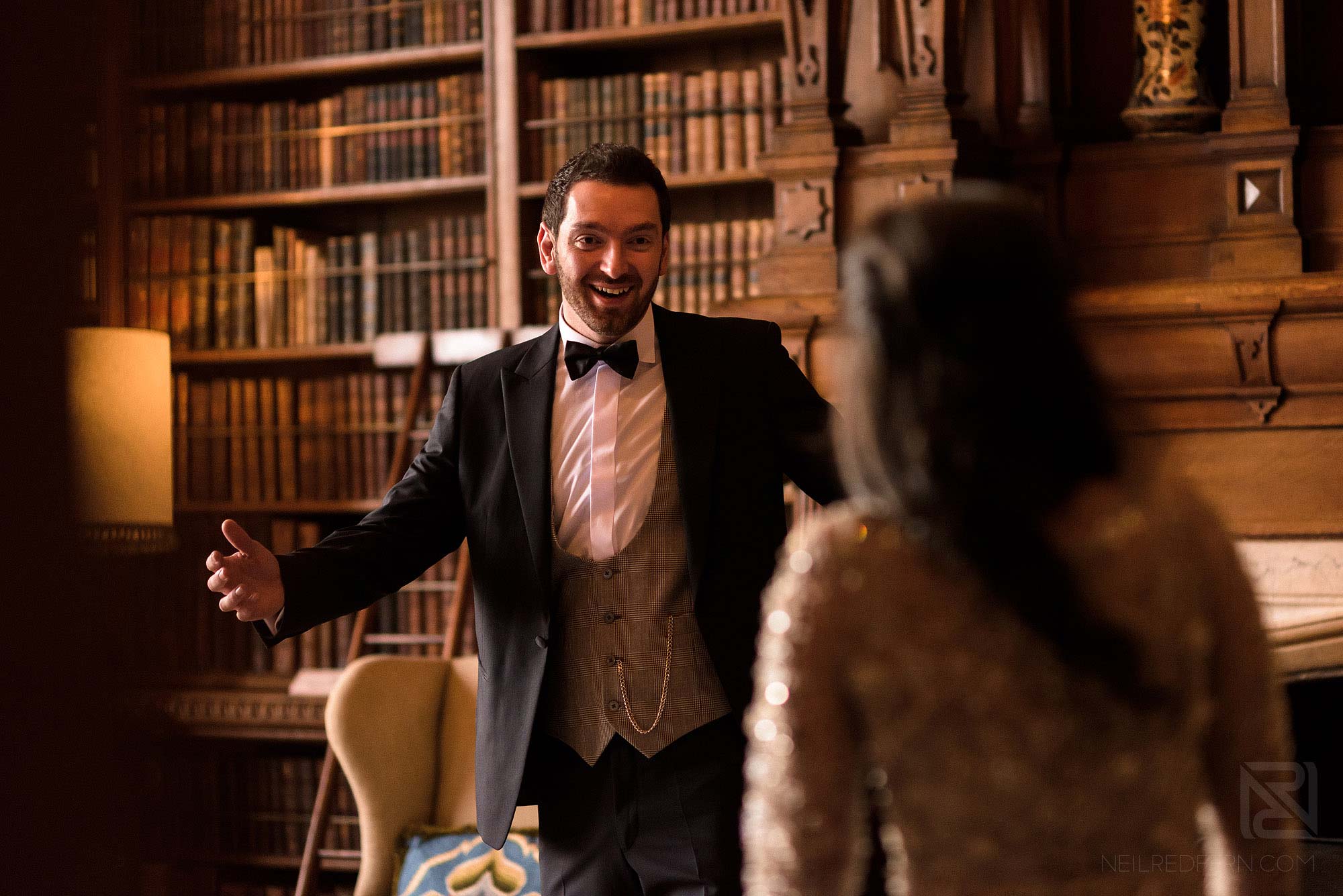 groom turning round to look at bride in Arley Hall
