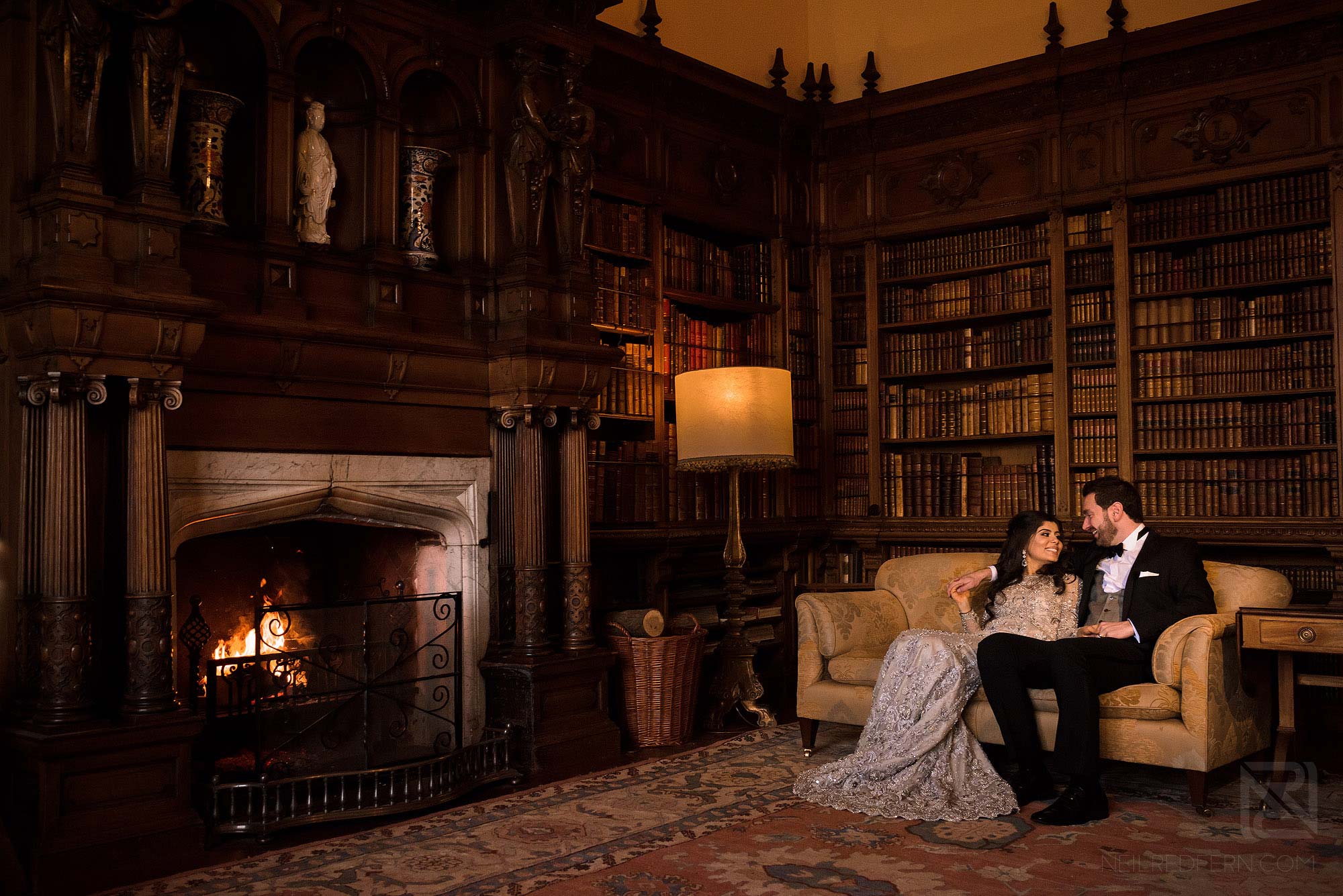 newlyweds sat together in Arley Hall Library