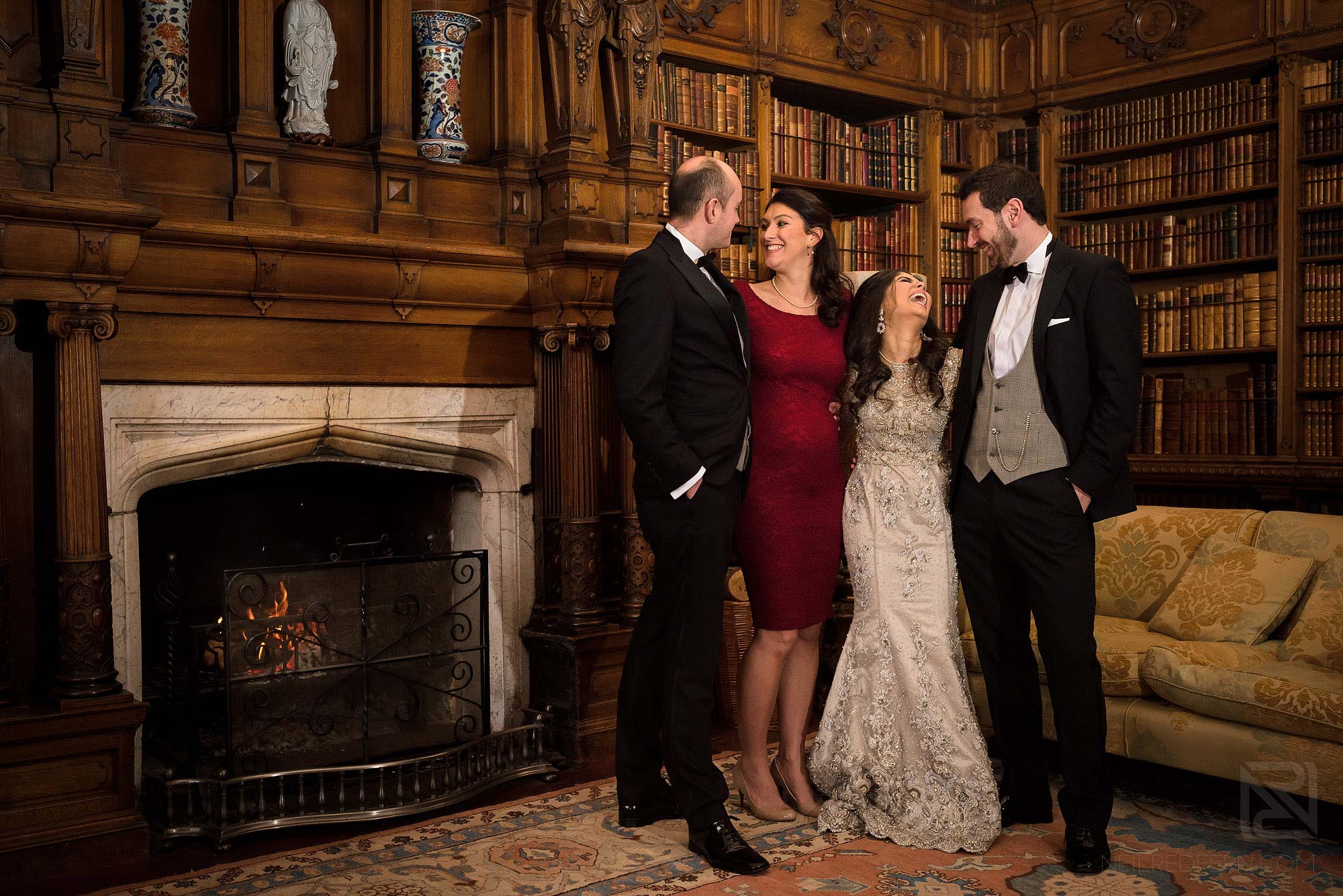 wedding group photograph in library at Arley Hall