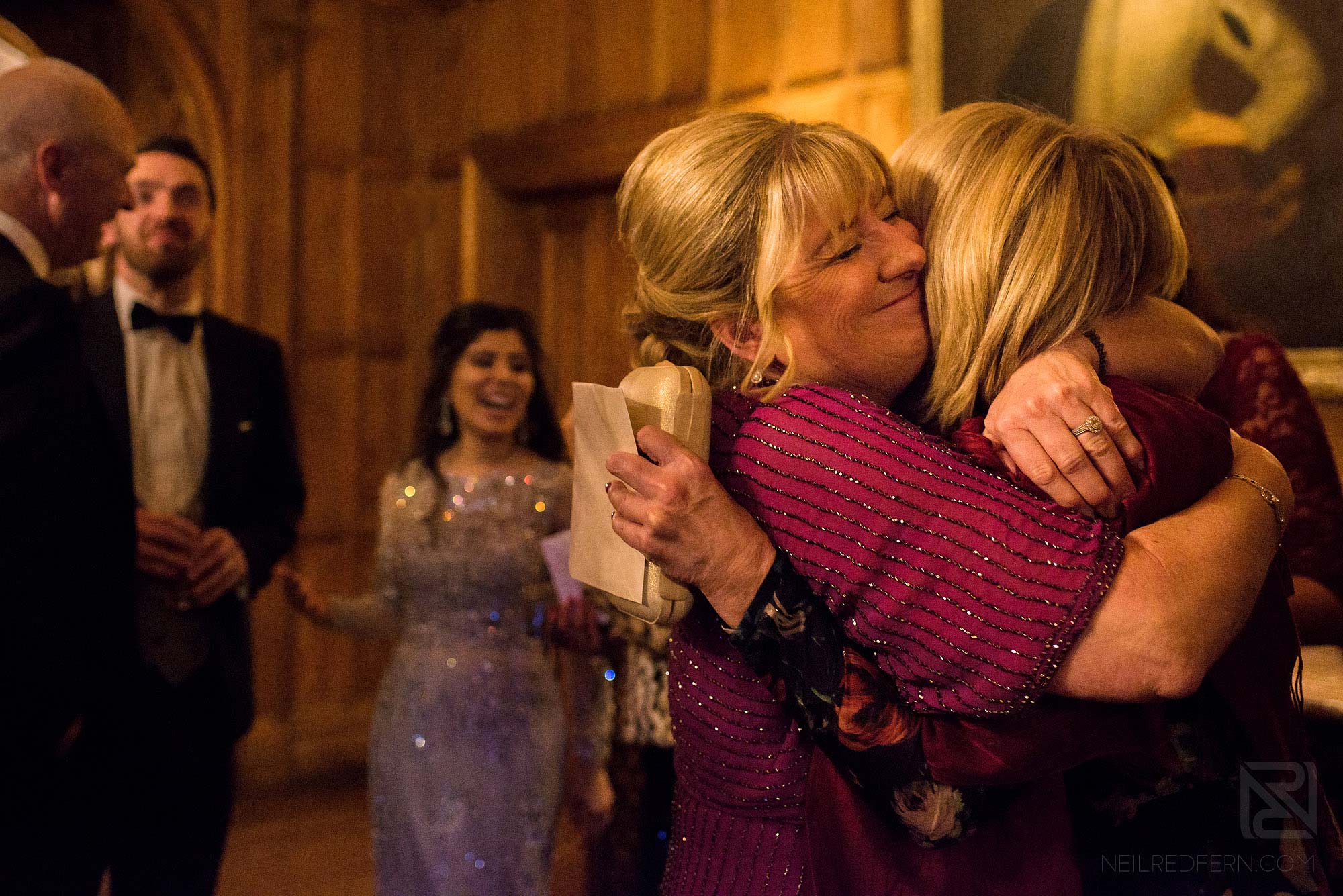 wedding guests hugging at Arley Hall winter wedding