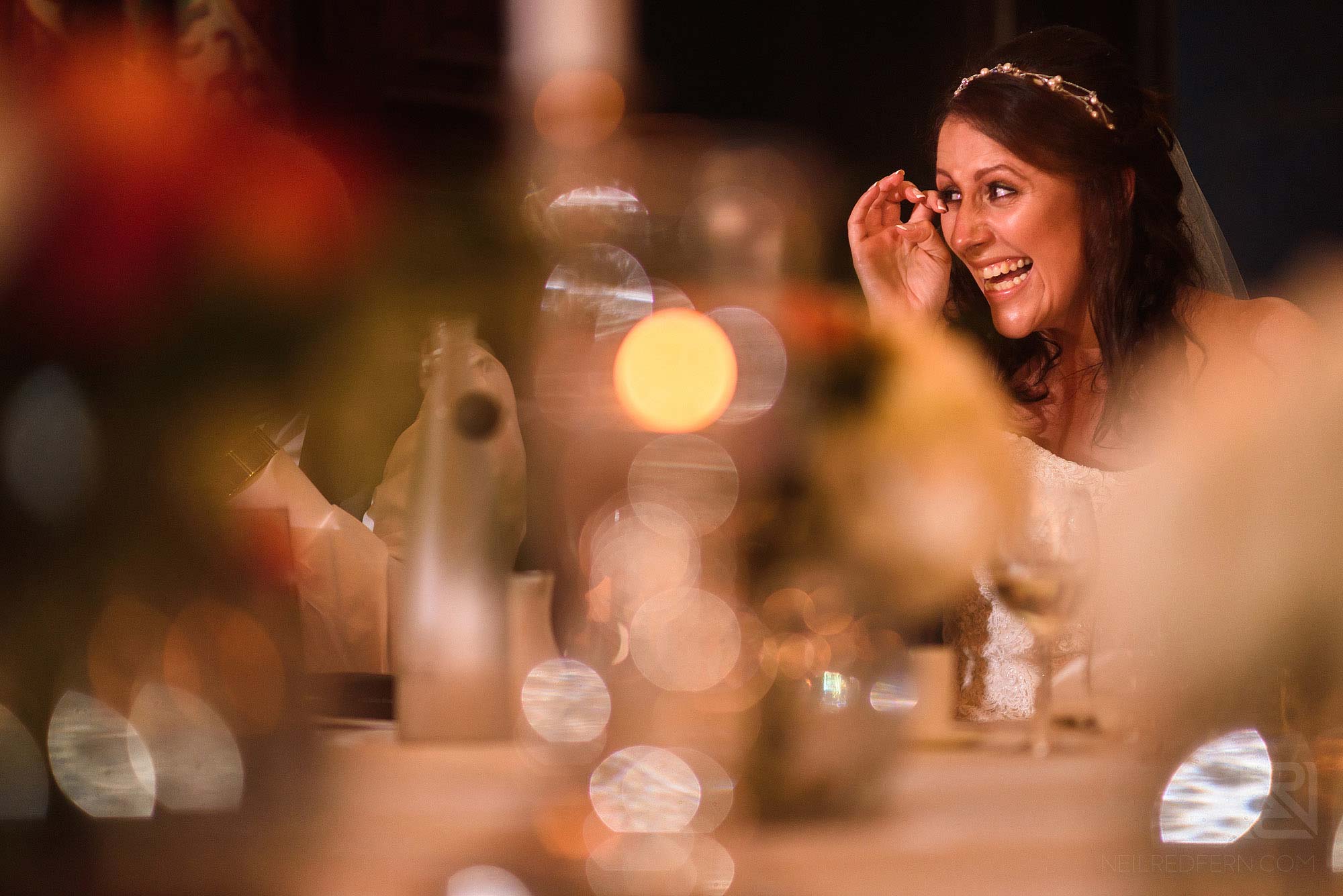 bride laughing during wedding speeches at Knowsley Hall